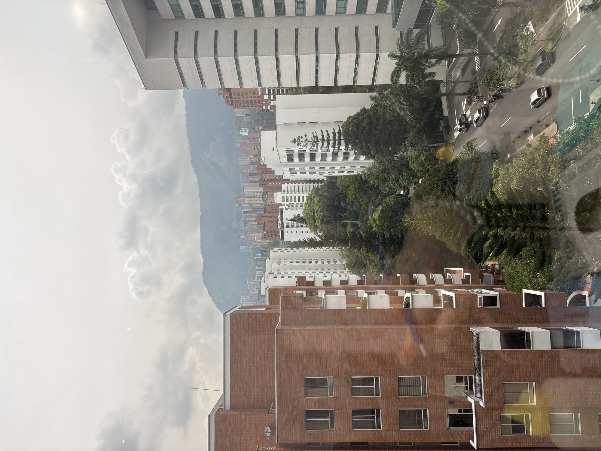 Panoramic city view captured from window in Medellín