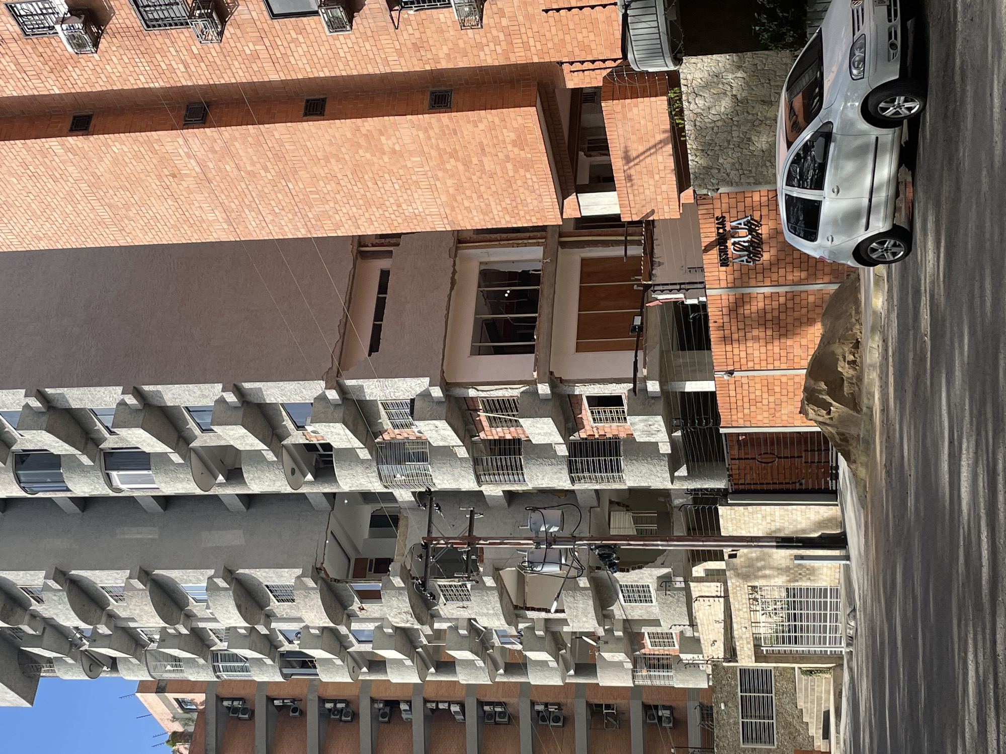 Maracay apartment blocks span damaged, intact, and unfinished