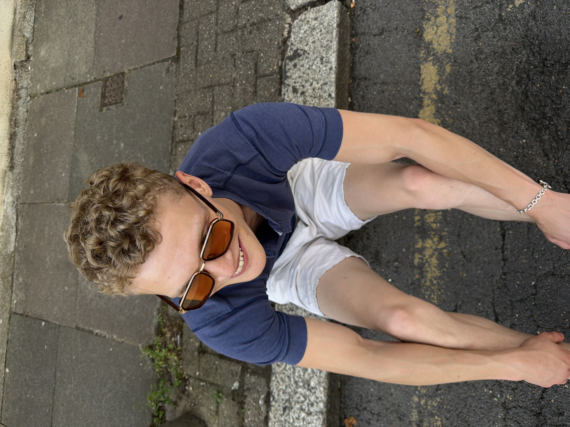 Sitting on a yellow-lined pavement in London