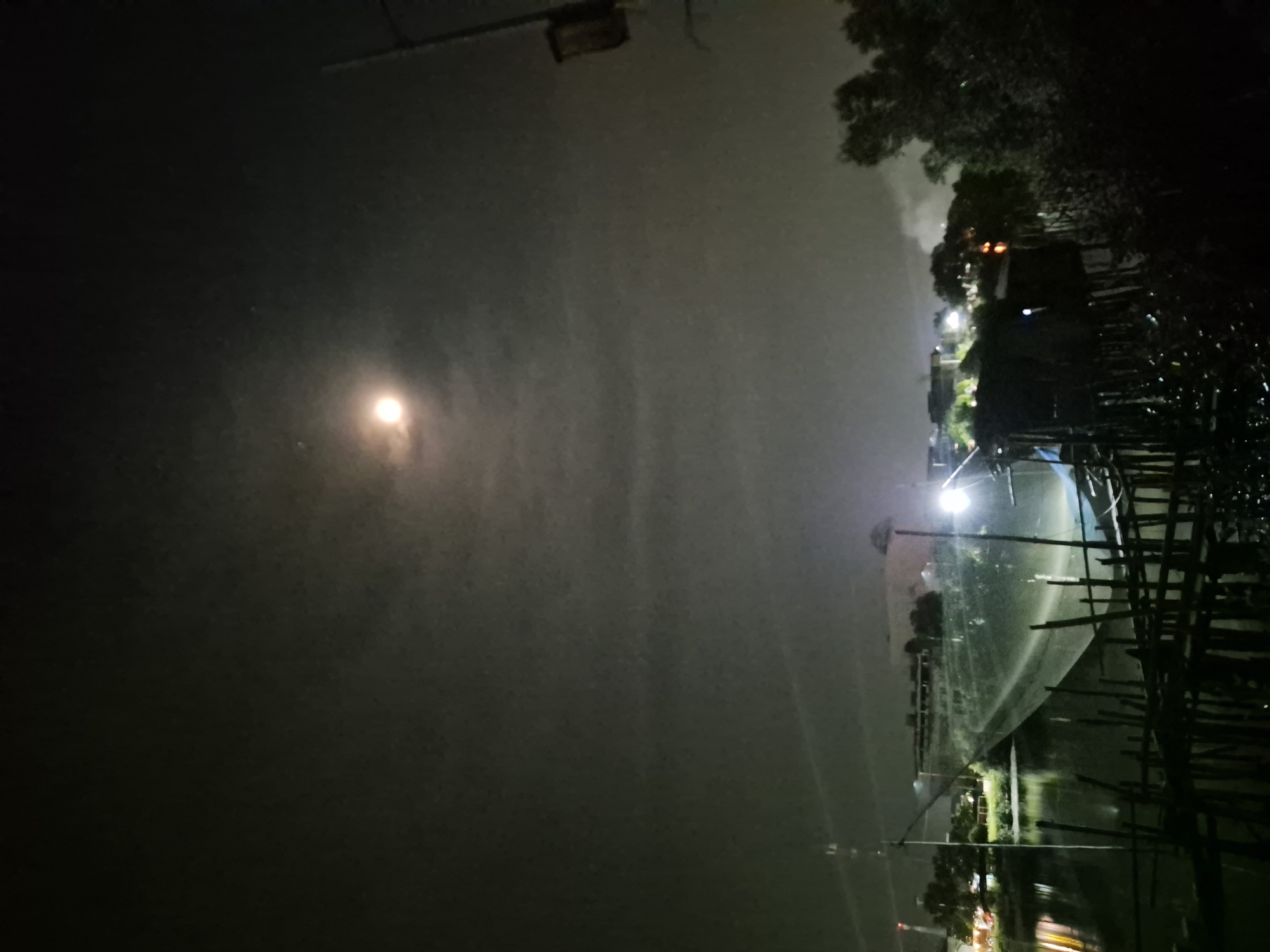 Nighttime scenes documented across Lhokseumawe, Indonesia waterways and businesses