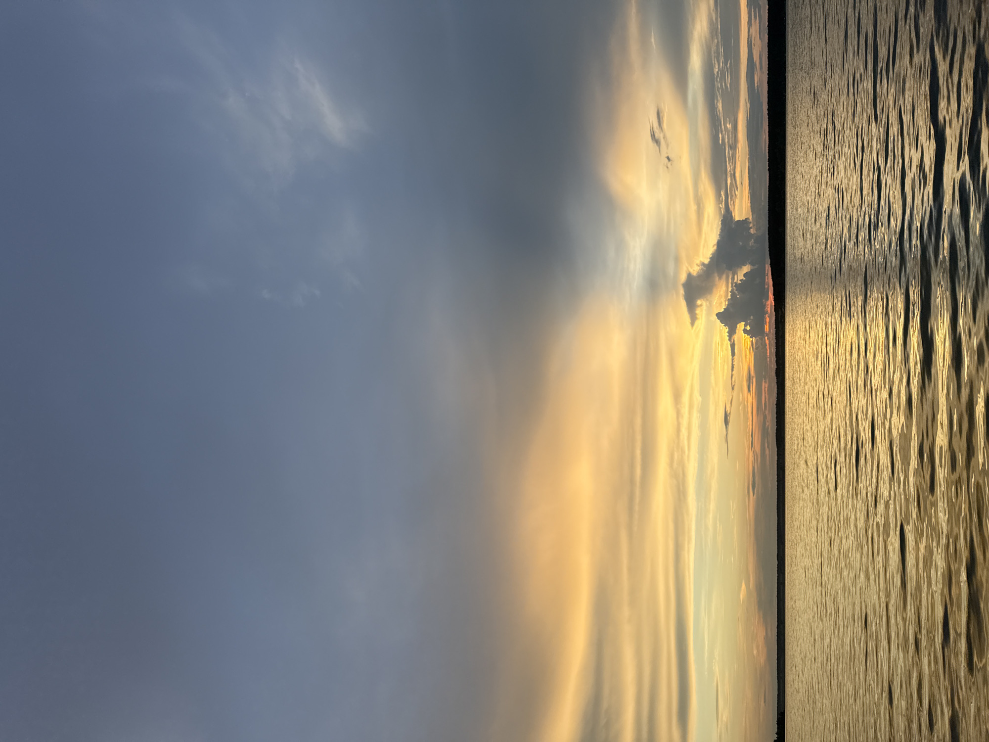 Lakeside evening with rainbows, sunsets, and a campsite