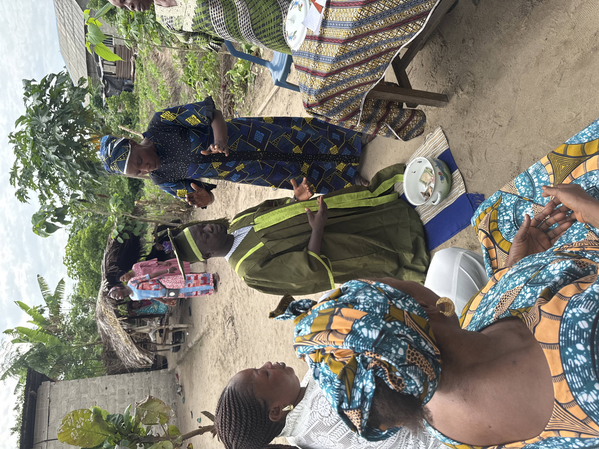 Outdoor ceremony with graduation attire observed in Tofa, Nigeria