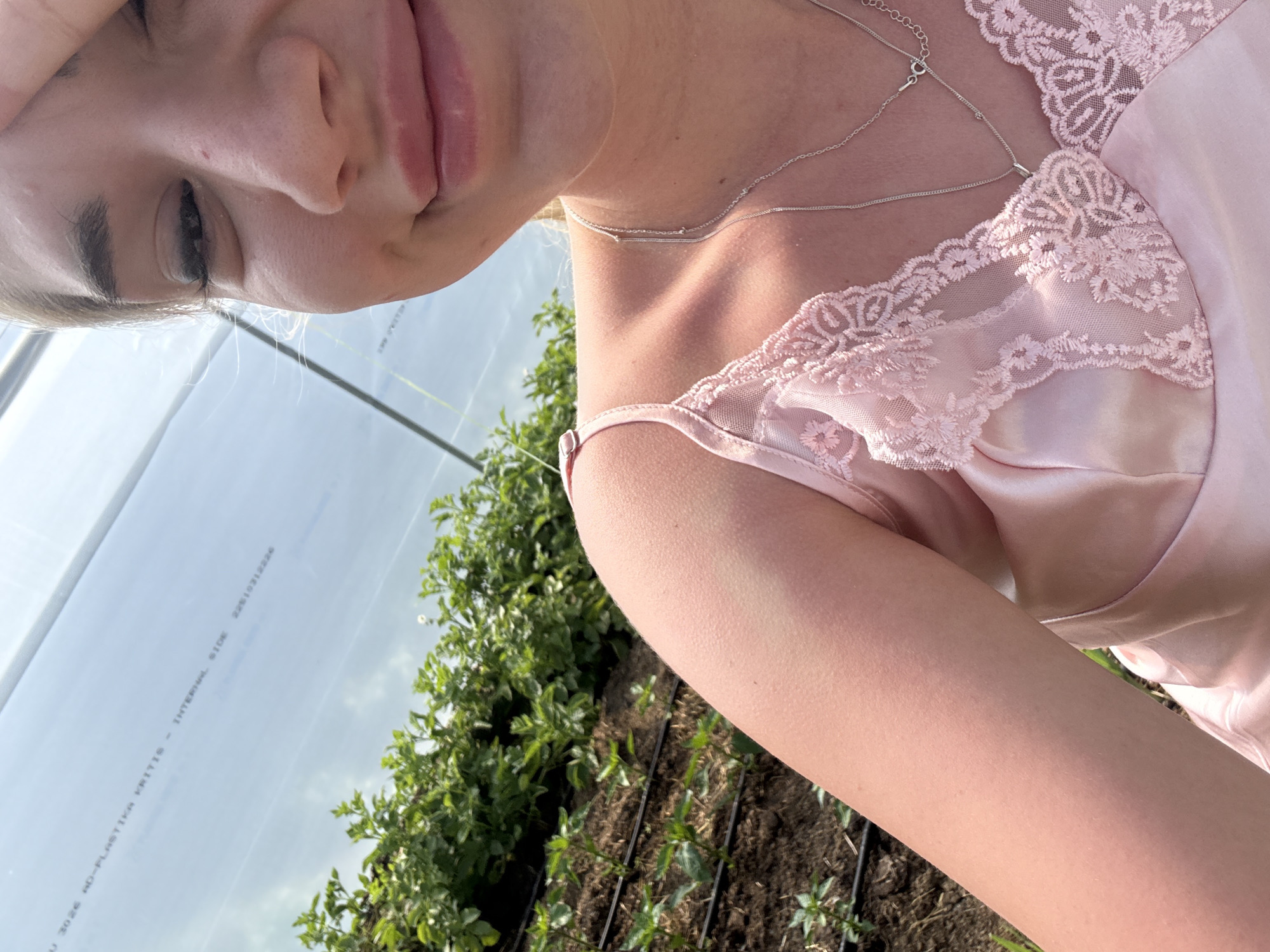 Woman poses for photos in Bulgarian greenhouse setting