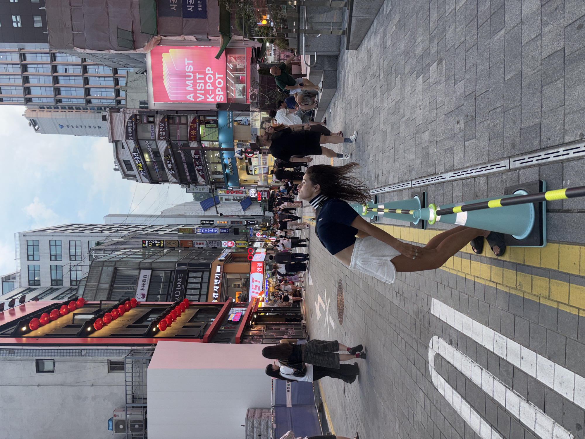 Busy morning in Myeongdong's streets, shops, and crowds