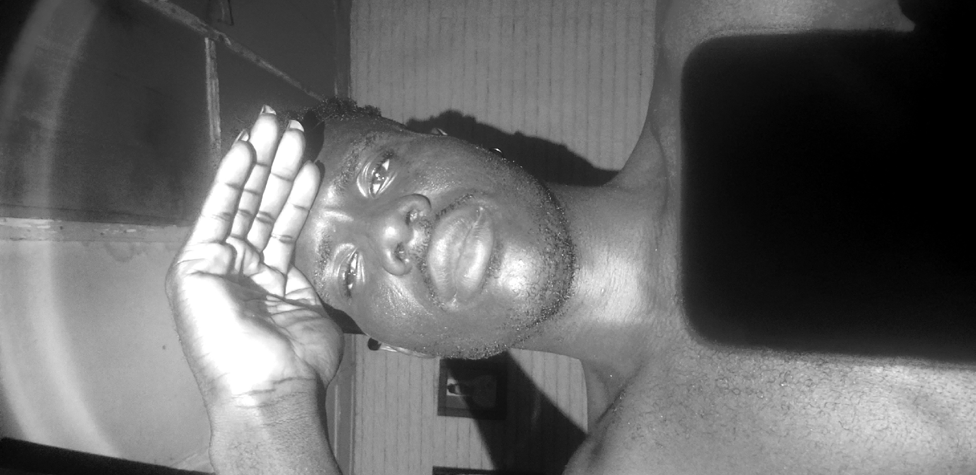 Close-up self-portrait series shot indoors in Narayi, Nigeria