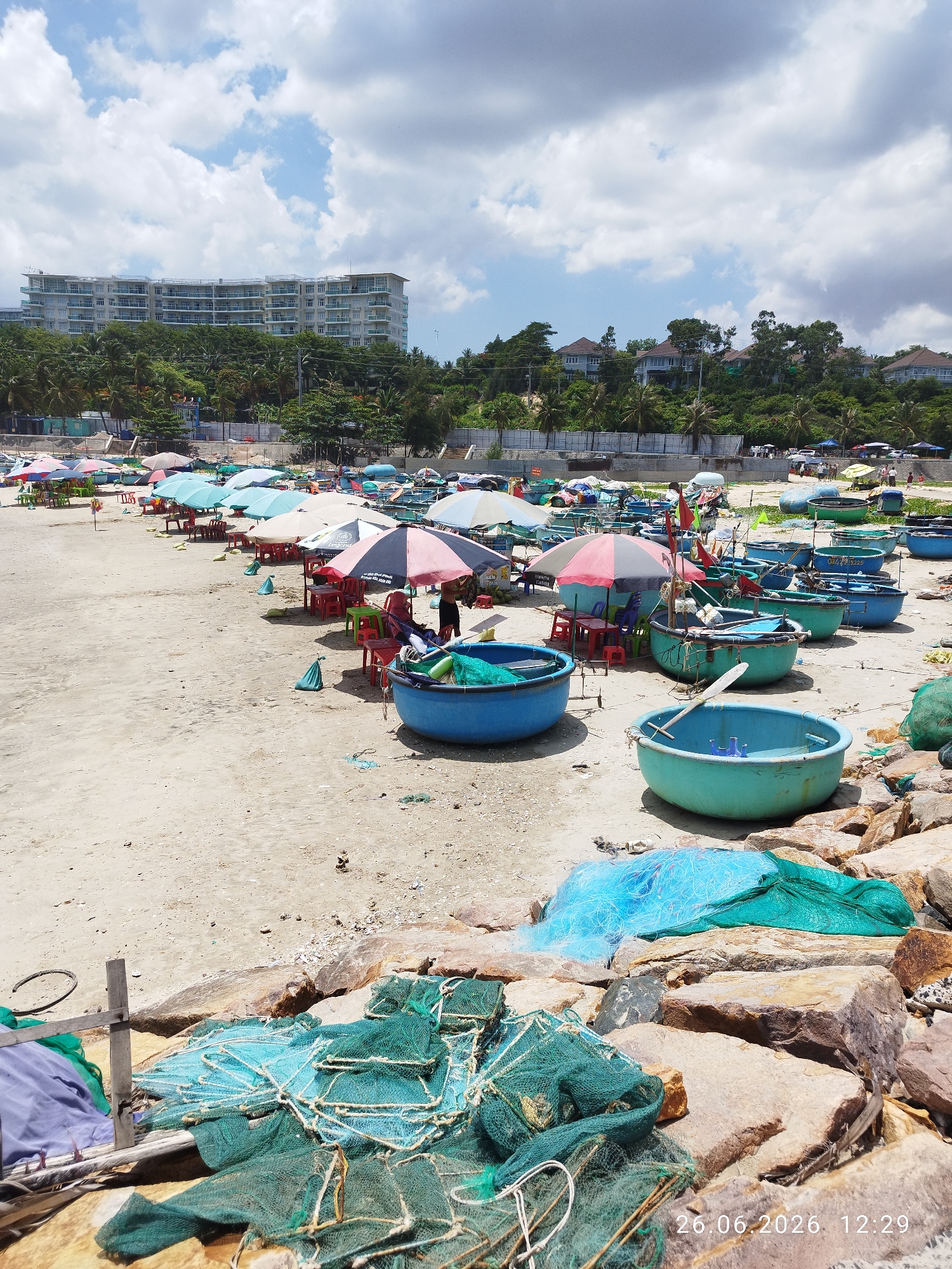 Colorful tetrapod breakwater draws a casual beach crowd in Phu Thuy