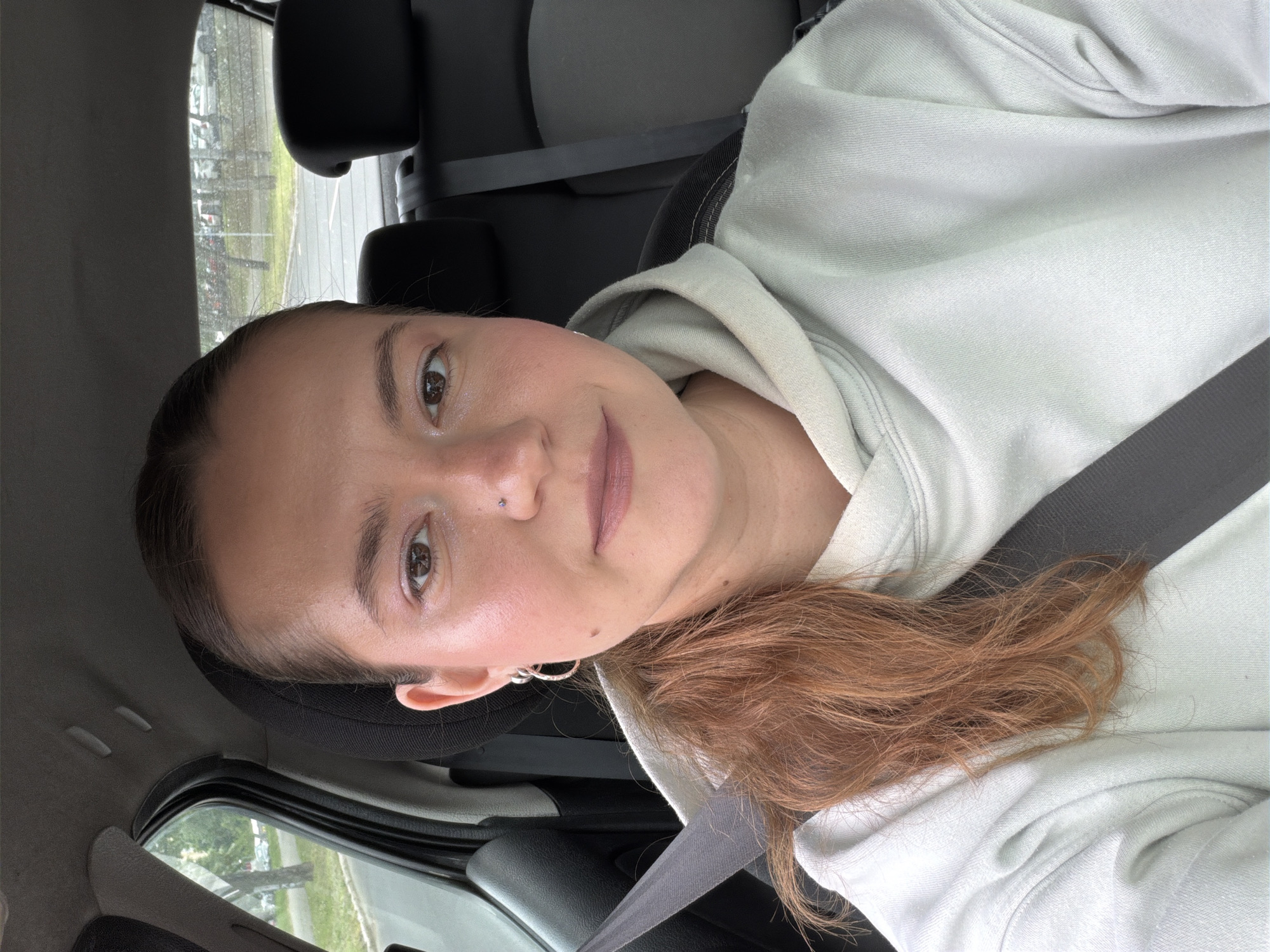 Woman documents drive through Belgrade suburb under overcast skies