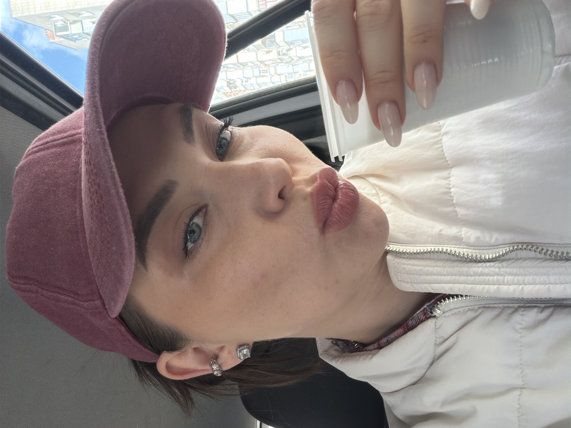 Woman makes kissing face with cup in Kamensk-Shakhtinsky