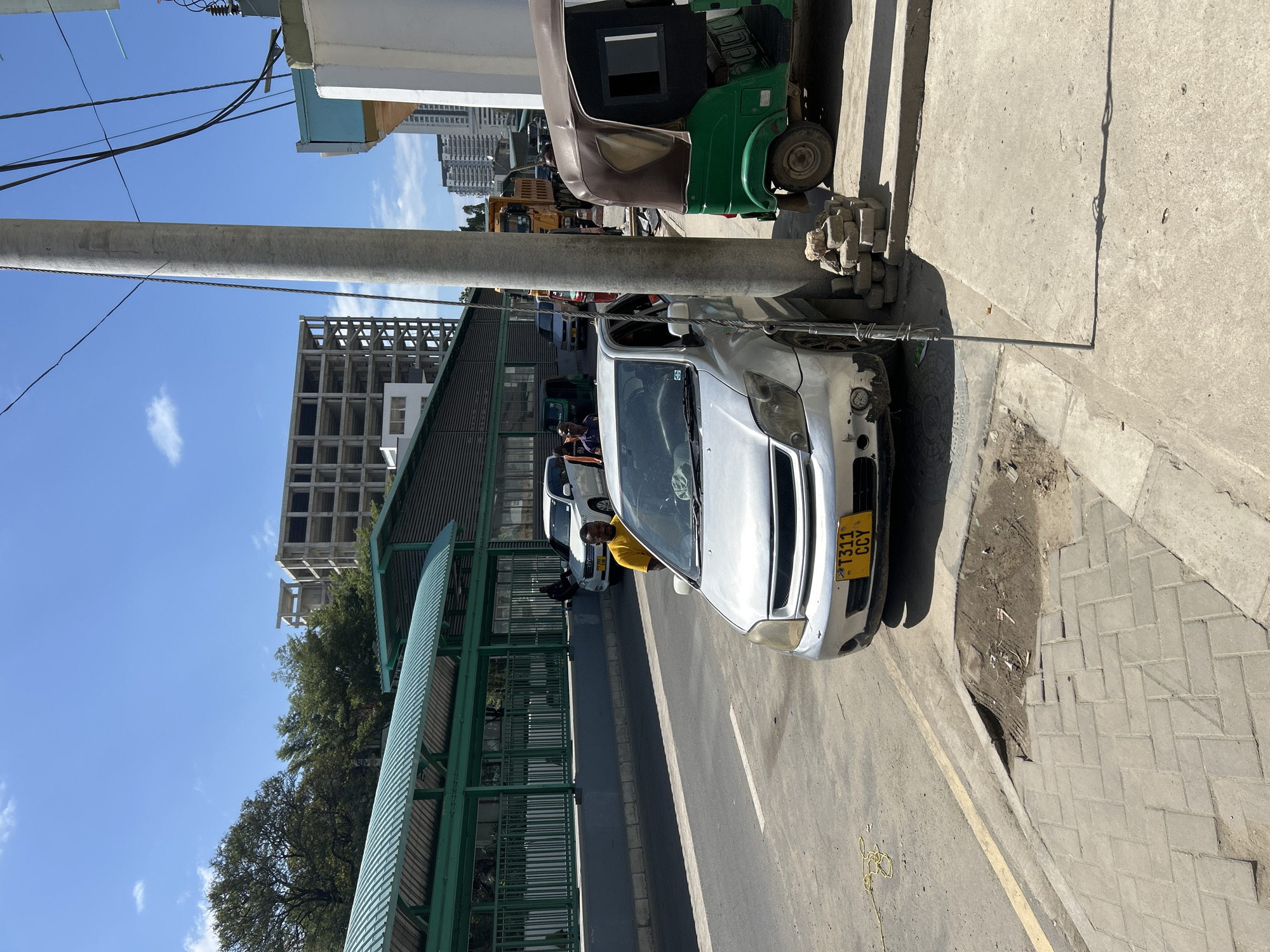 Street-level snapshot of Dar es Salaam on a sunny morning