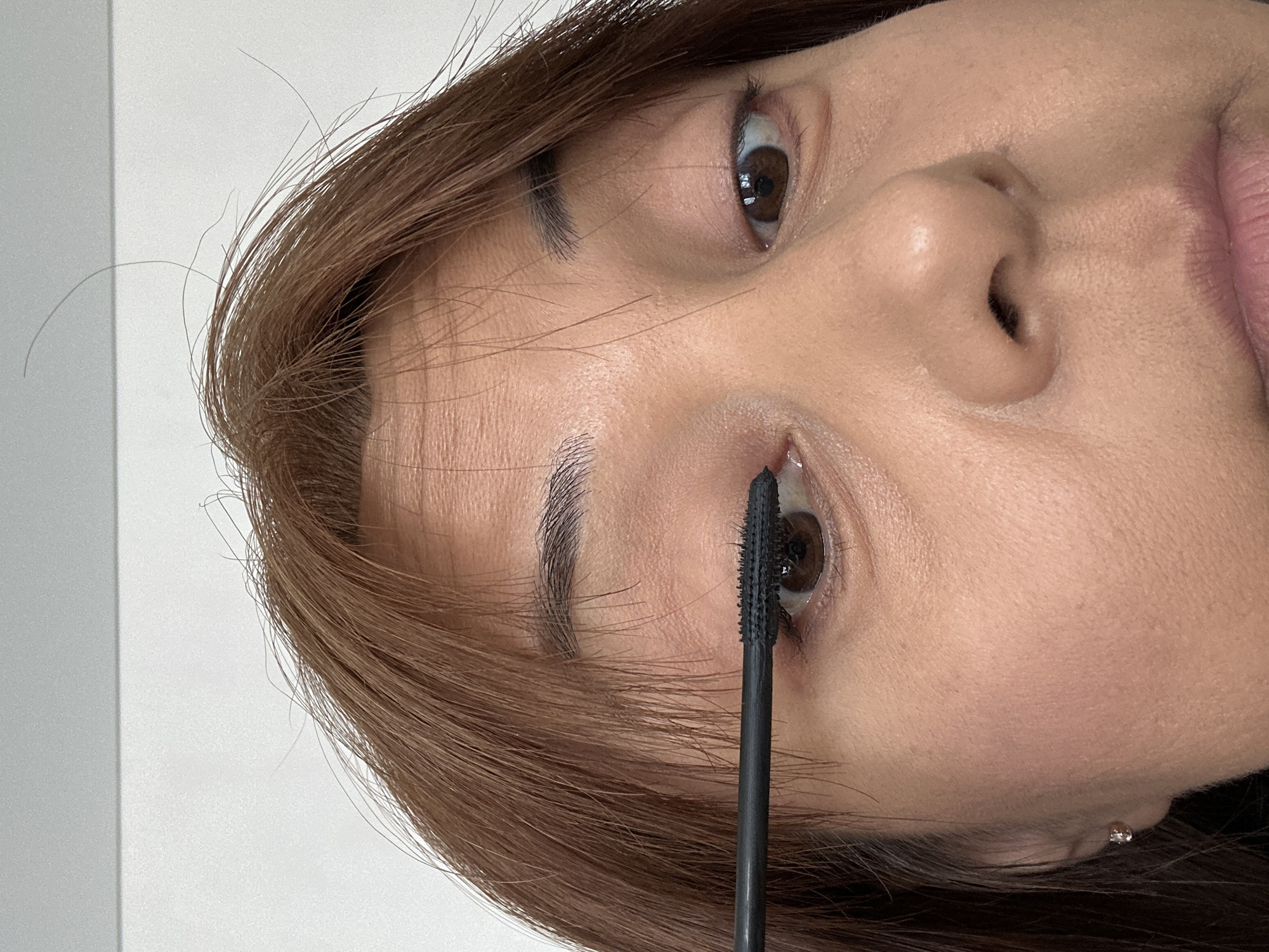 Woman's morning makeup routine documented over 12 minutes indoors