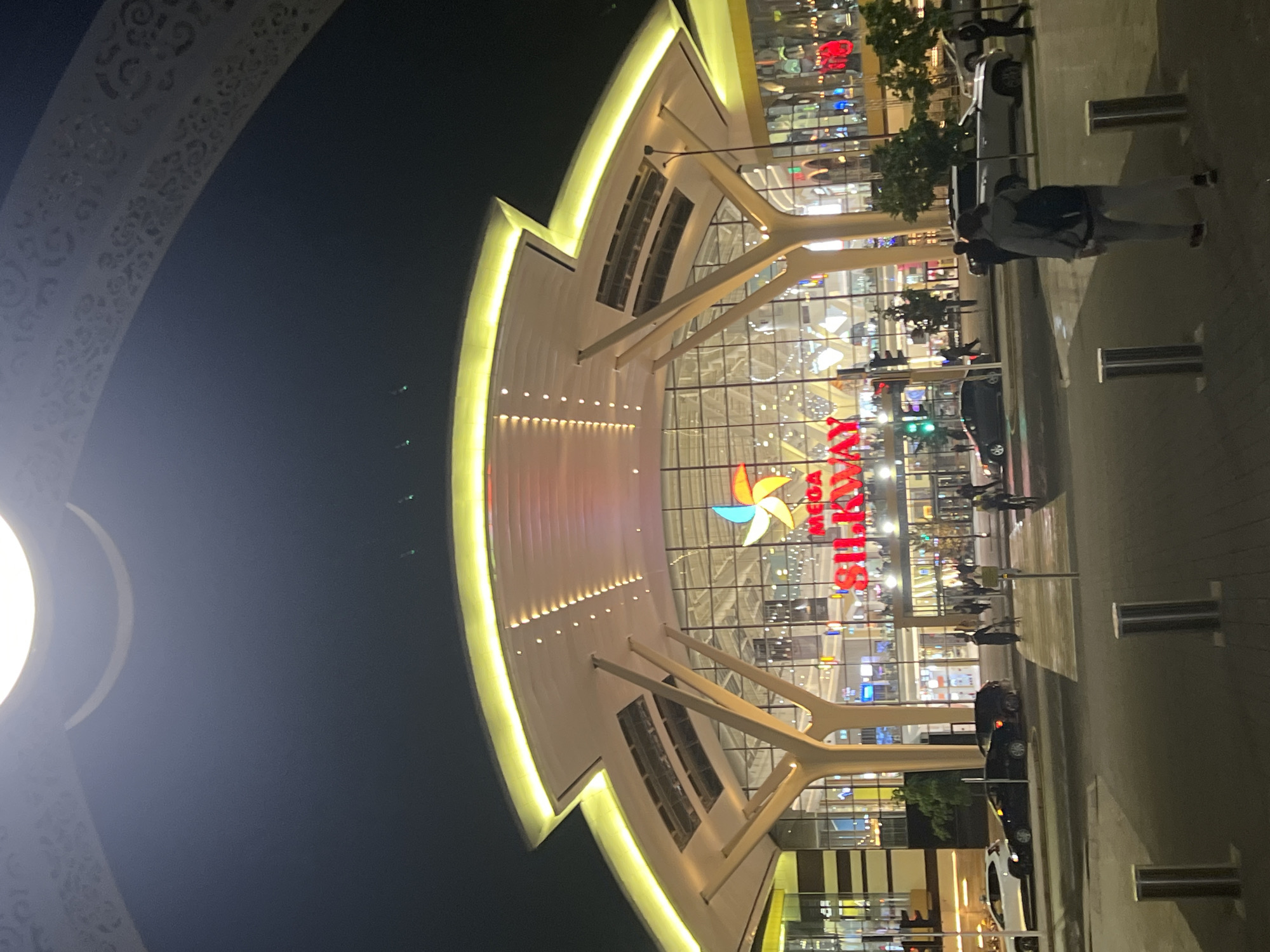 Mega Silk Way mall illuminated at night in Astana