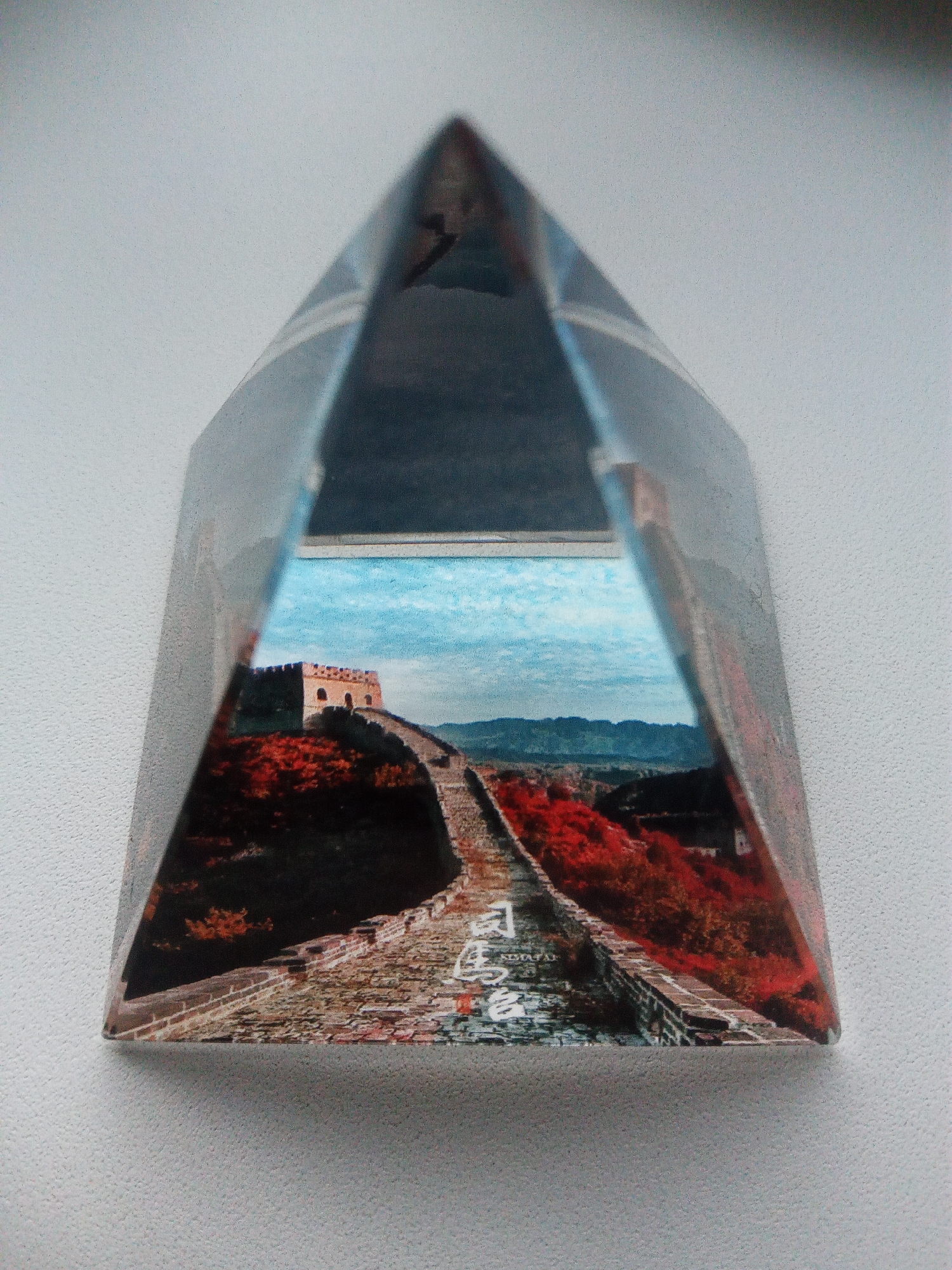 Great Wall souvenir prisms and a glowing gaming setup in Usman