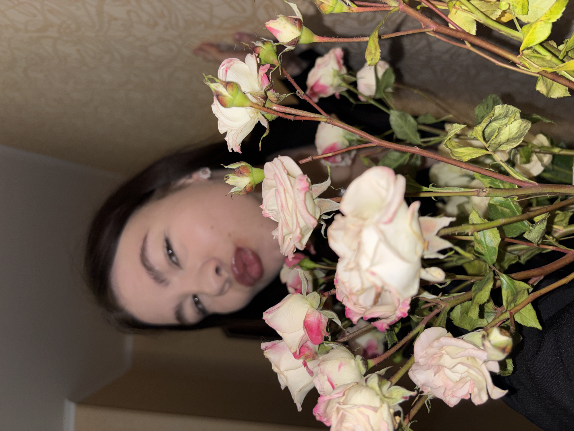 Woman photographed with rose bouquet in Perm, Russia