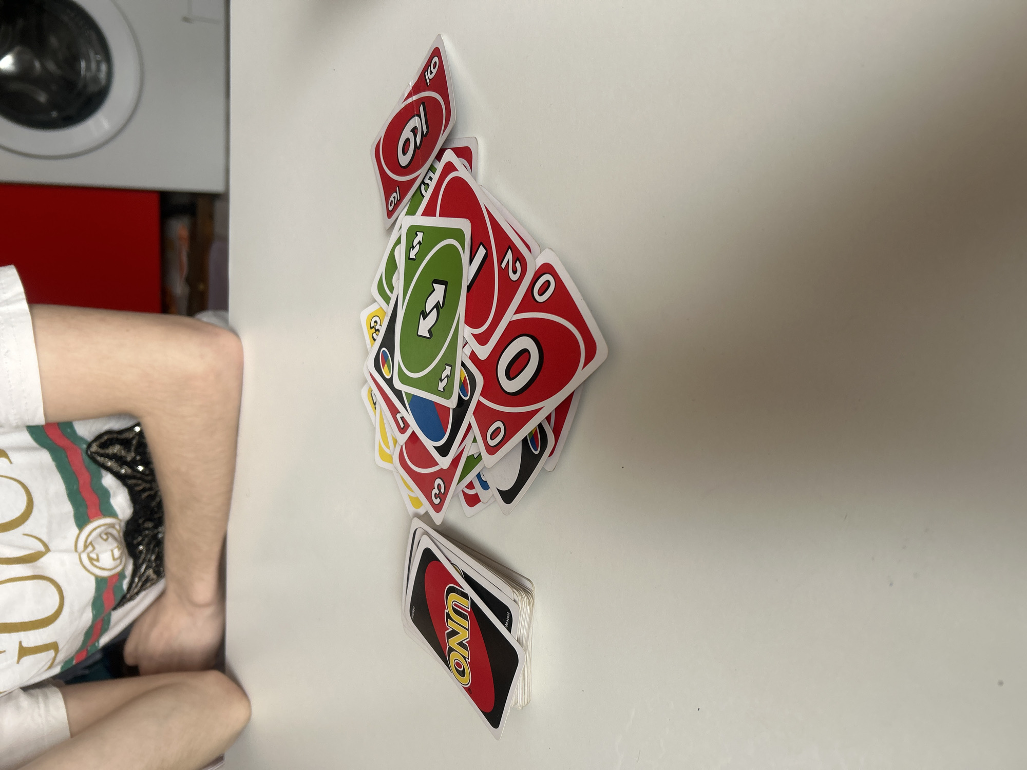 Child plays Uno cards in Tsarevo home