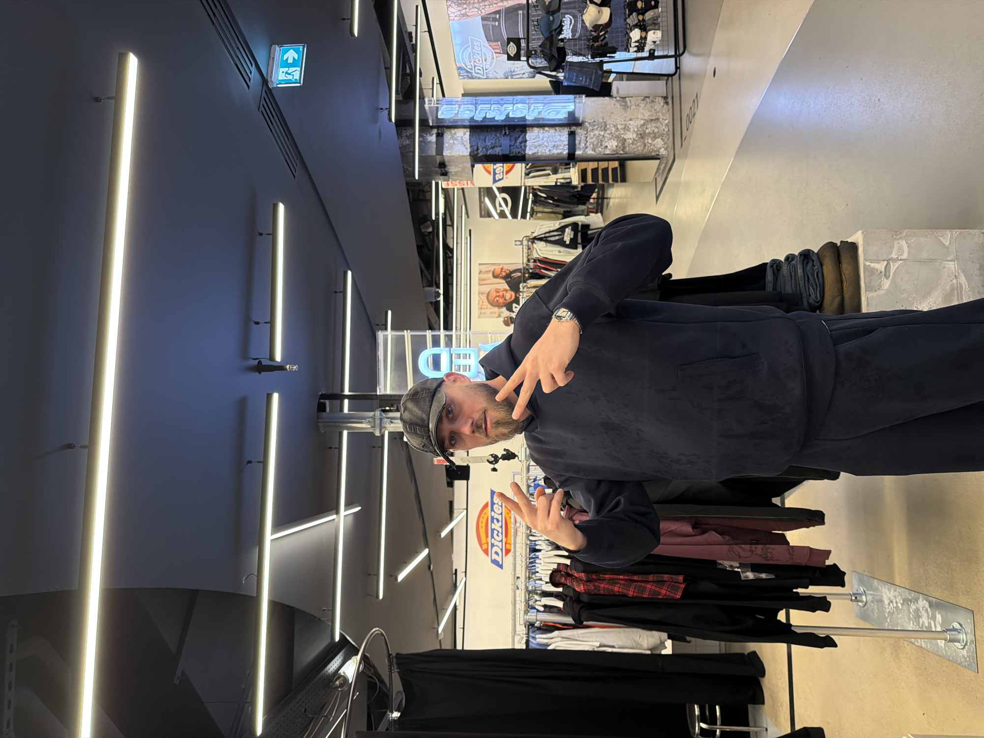 Shoppers browse clothing store in Paris during afternoon