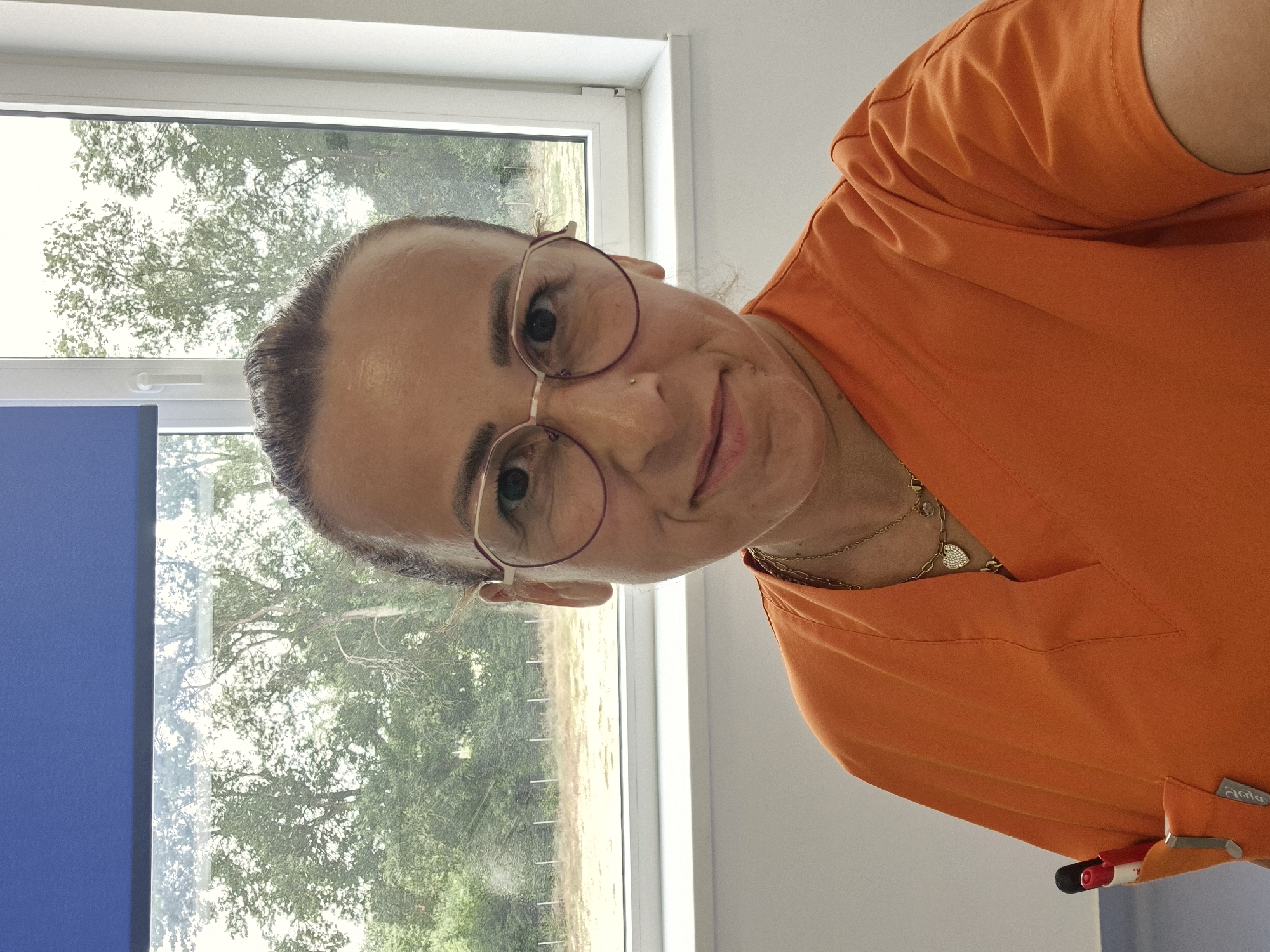 Portrait series in orange scrubs, medical setting