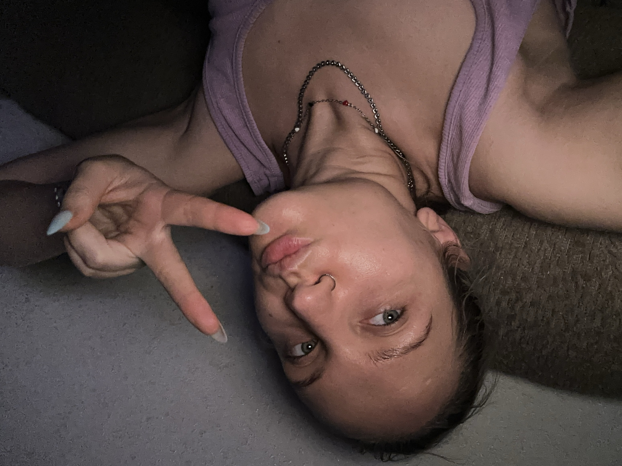 Person in purple tank top spotted lying indoors in Esenyurt