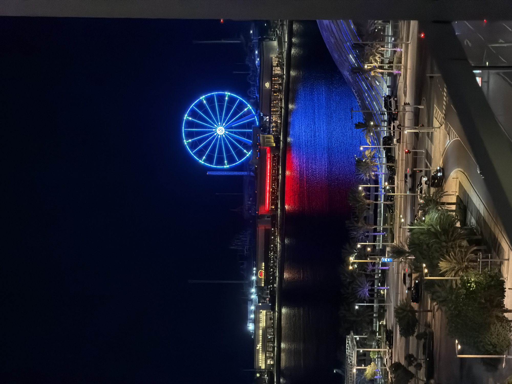 Nighttime views captured of illuminated Lusail waterfront from elevated perspective