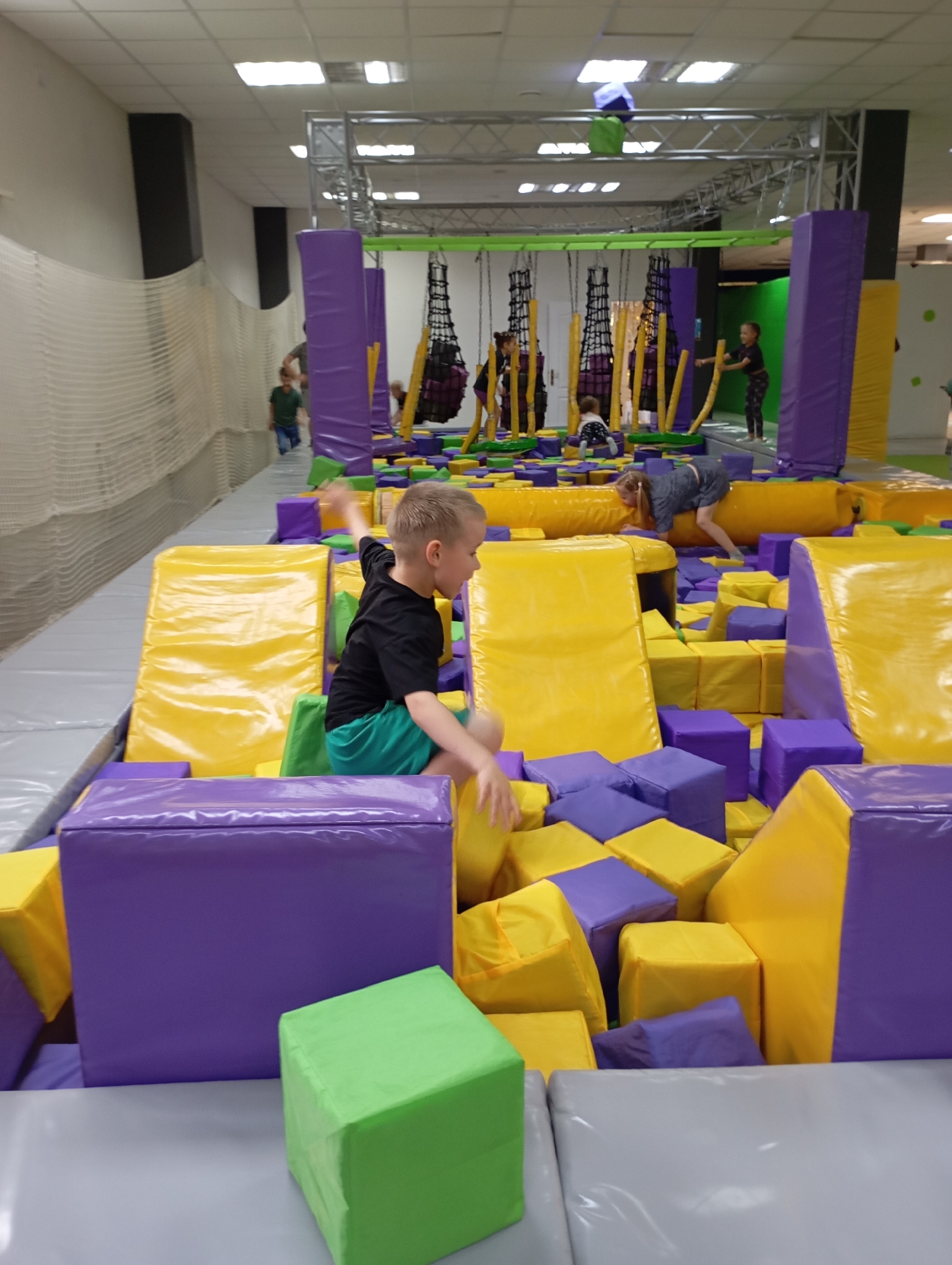 Children enjoy active play at indoor entertainment facility