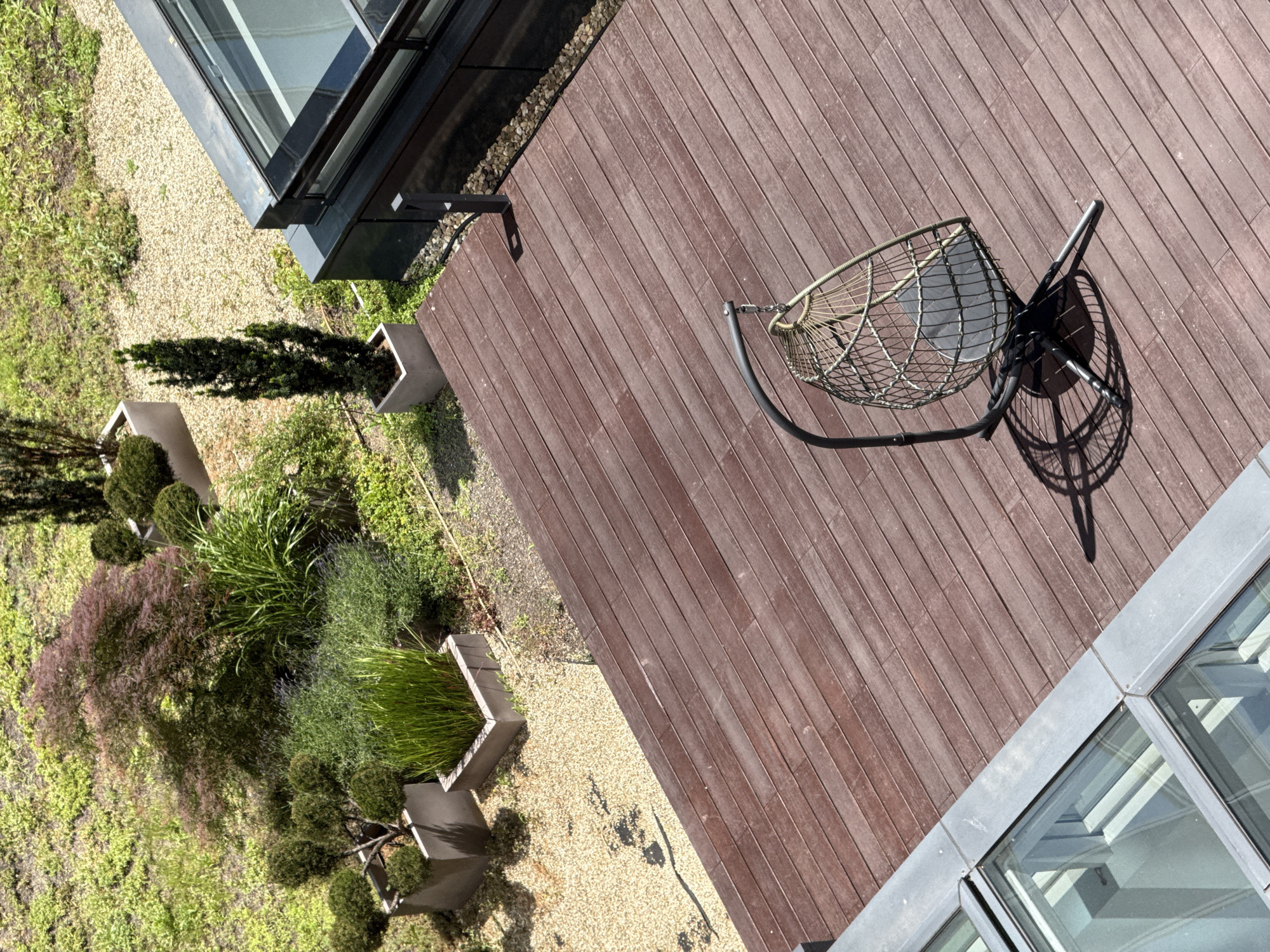 Rooftop terrace with wooden deck observed in Sofia