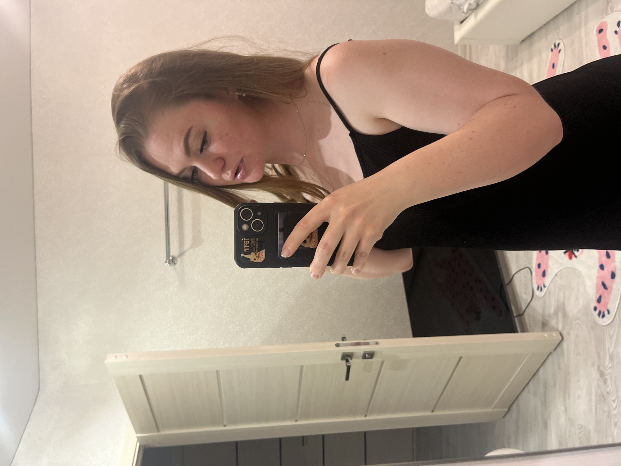 Woman Takes Mirror Selfies in Multiple Indoor Locations
