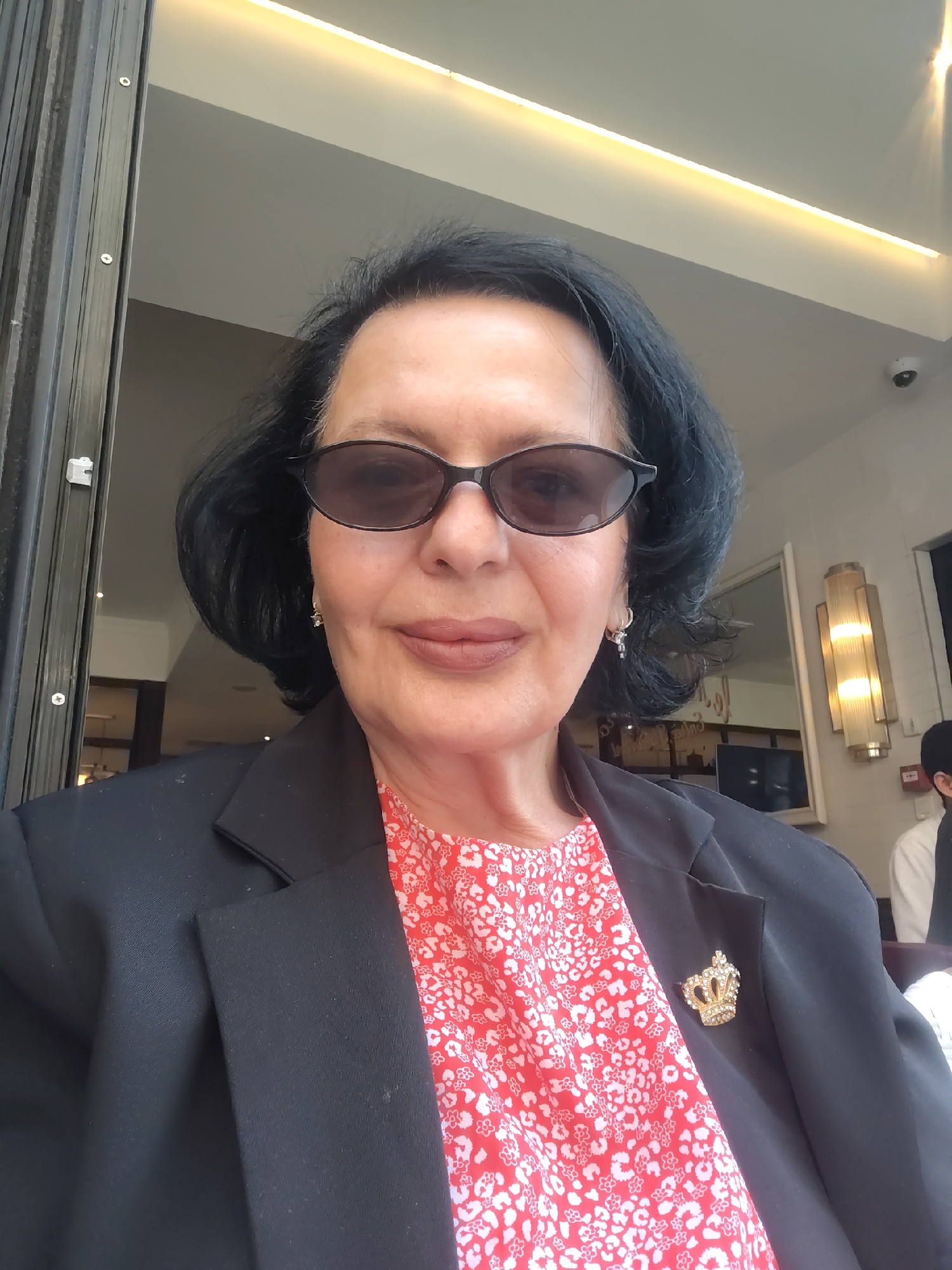 Well-dressed woman with crown brooch spotted in Strasbourg