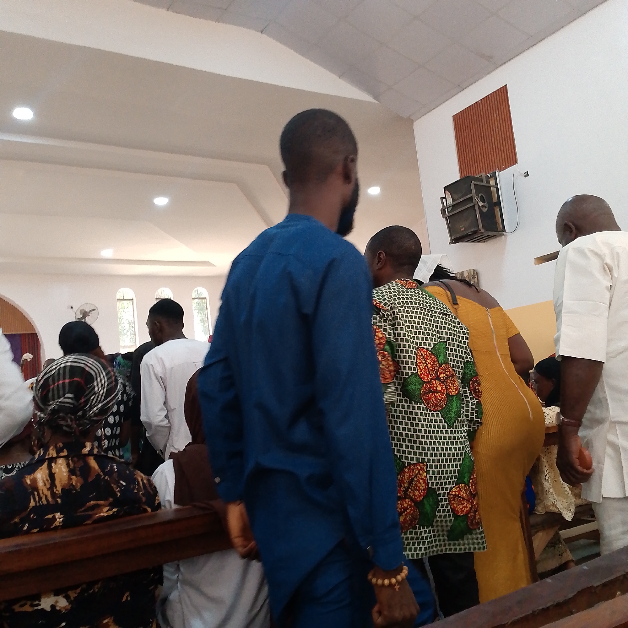 Religious gathering documented at unidentified church with diverse attendees