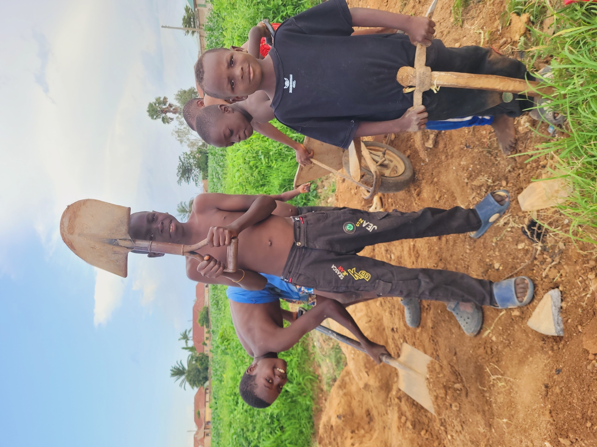 Young boys perform manual labor in Bukuru Nigeria