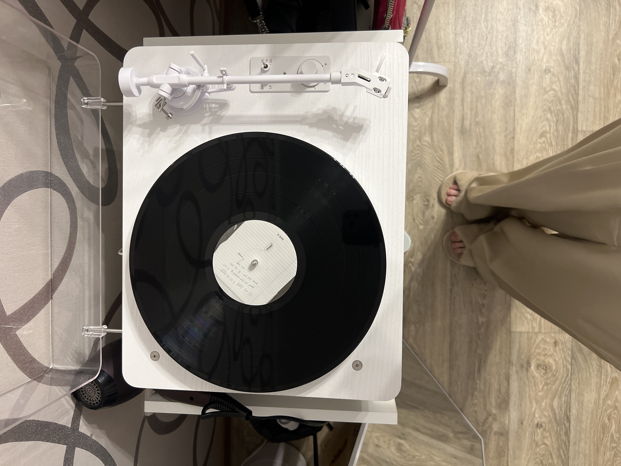 Woman documents vinyl listening session with selfies in Kazan