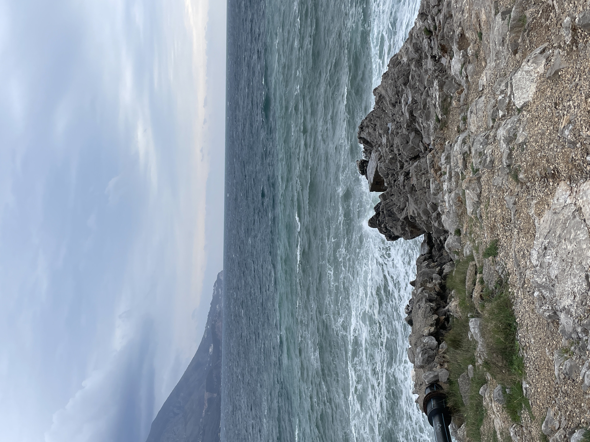 Visitor documents stormy coastal scenery in Budva, Montenegro