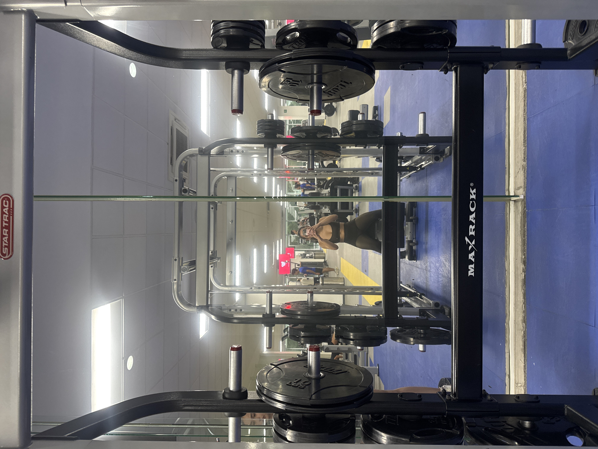 Gym interior captured in mirror reflection in Puebla