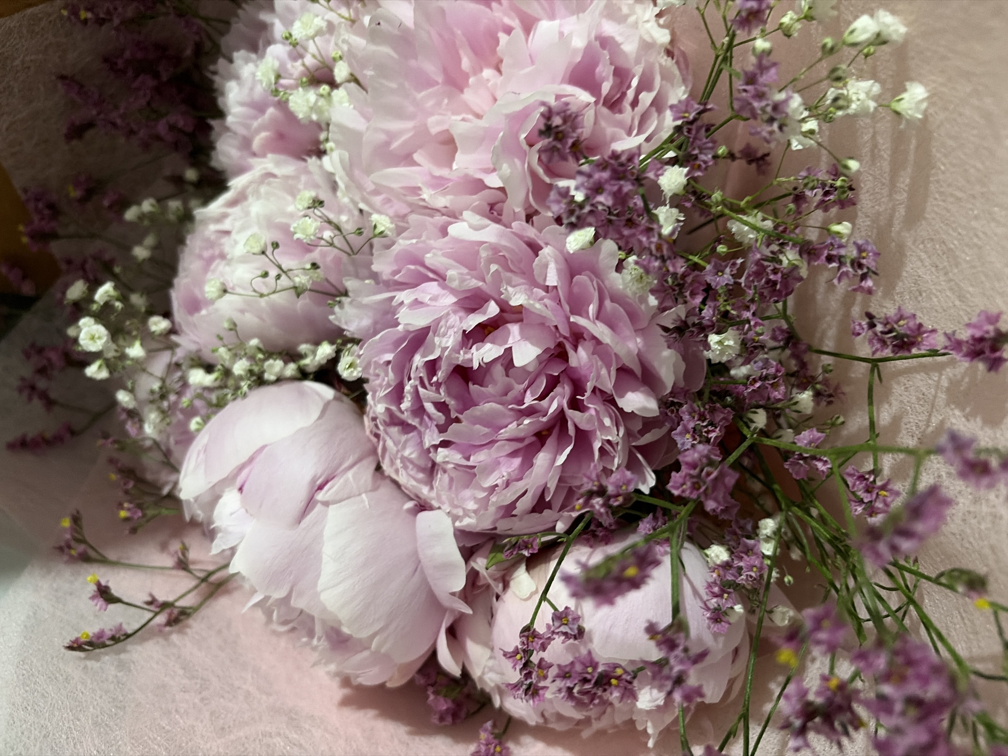 Pink peony bouquet with white, purple accents documented