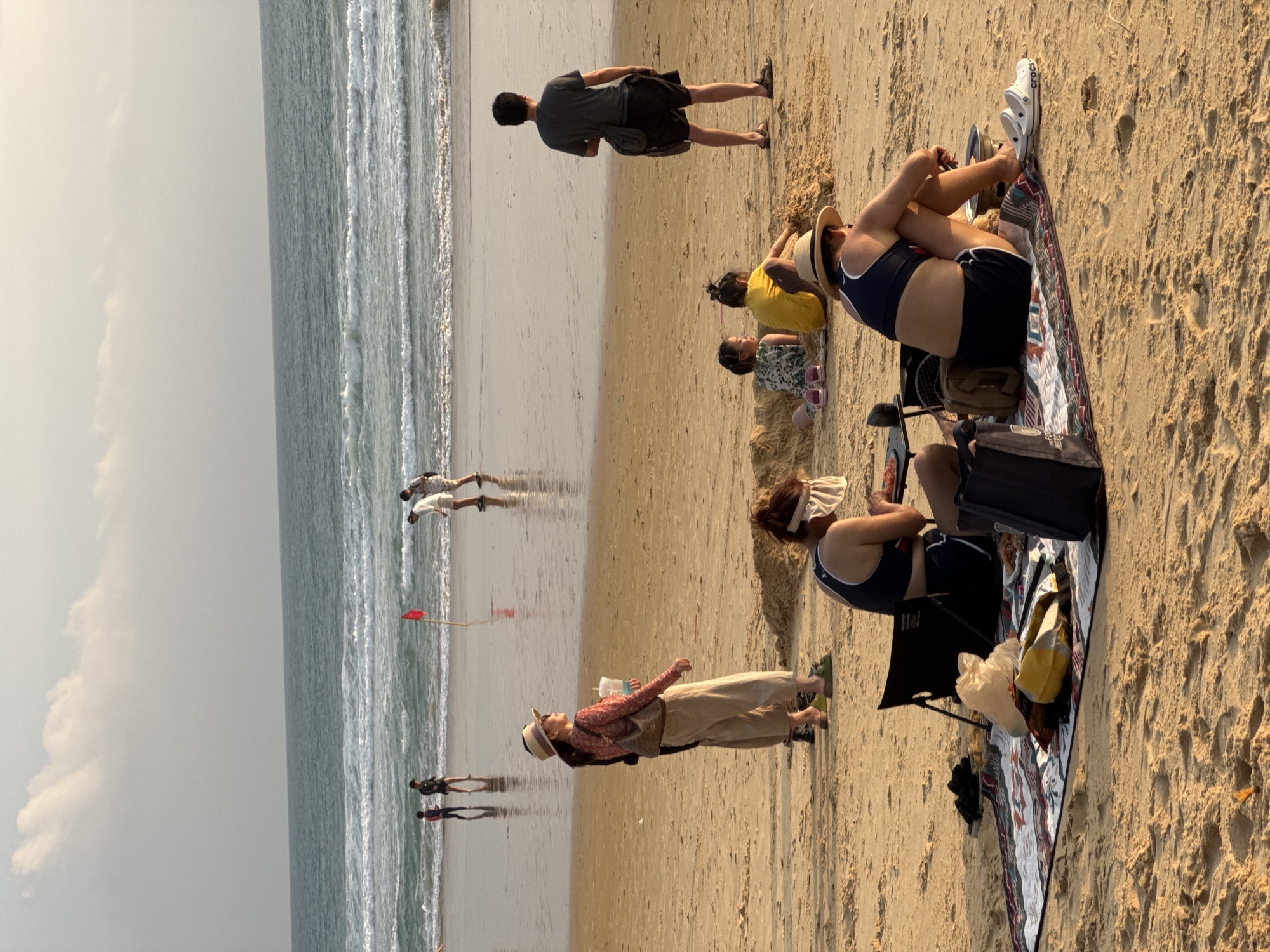 Karon Beach buzzing through a golden-hour afternoon