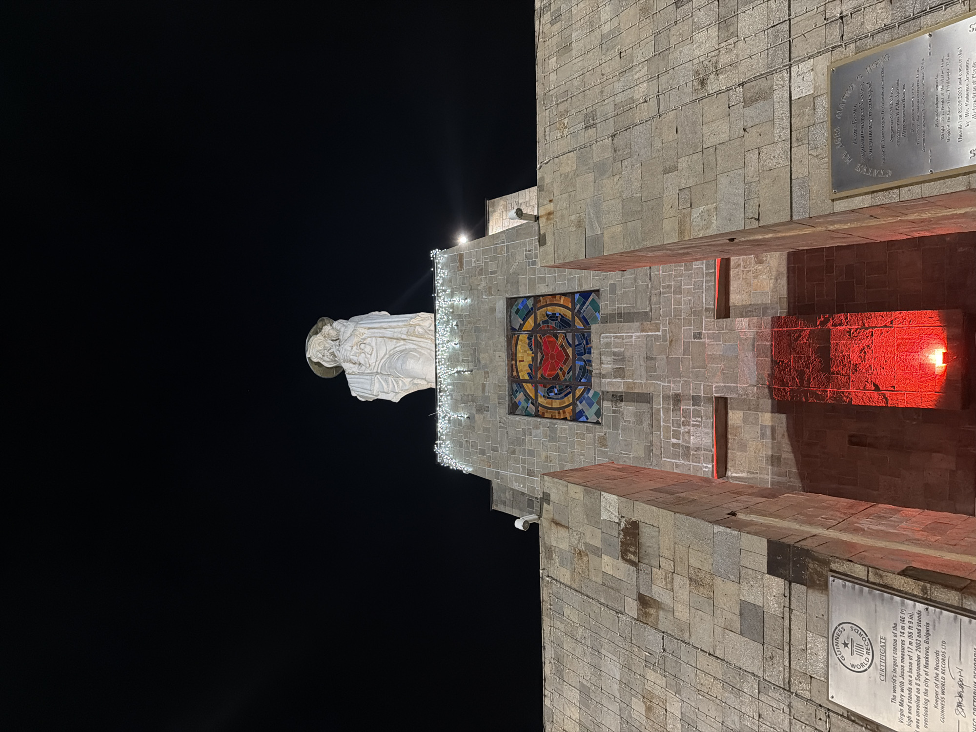 Nighttime documentation of illuminated Virgin Mary monument in Haskovo, Bulgaria