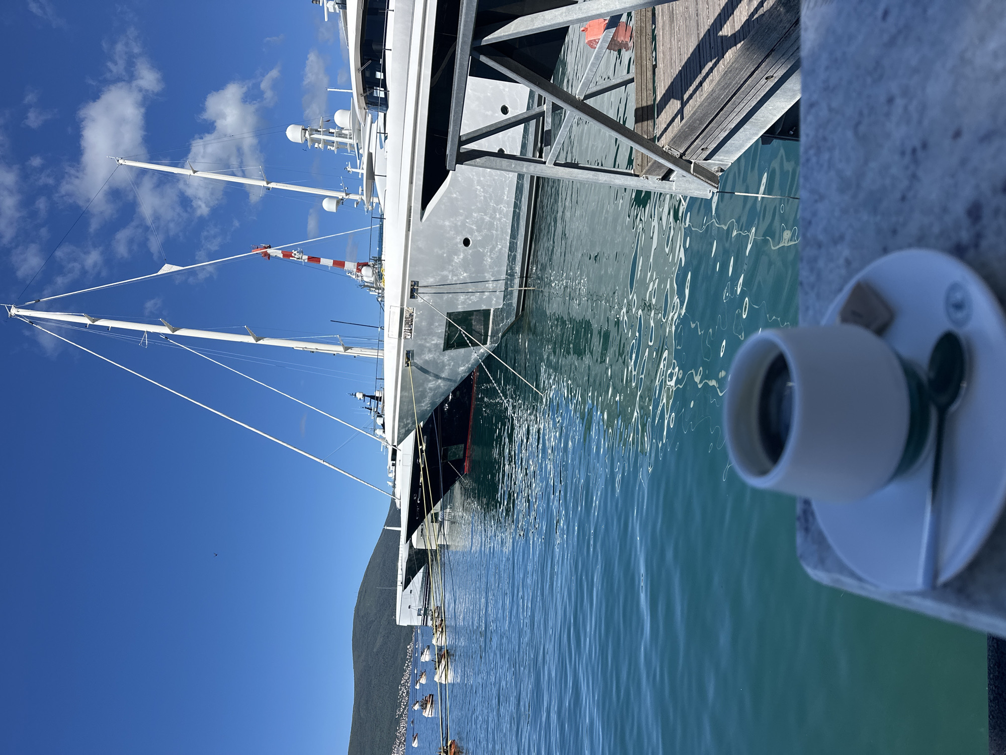 Luxury yachts dock at Tivat marina under clear skies