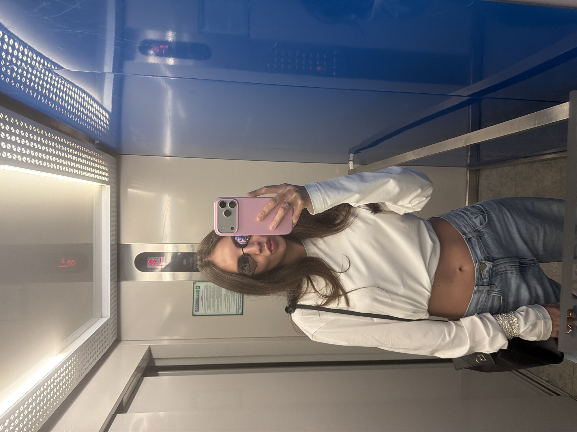 Woman Takes Elevator Selfie in Krasnoyarsk