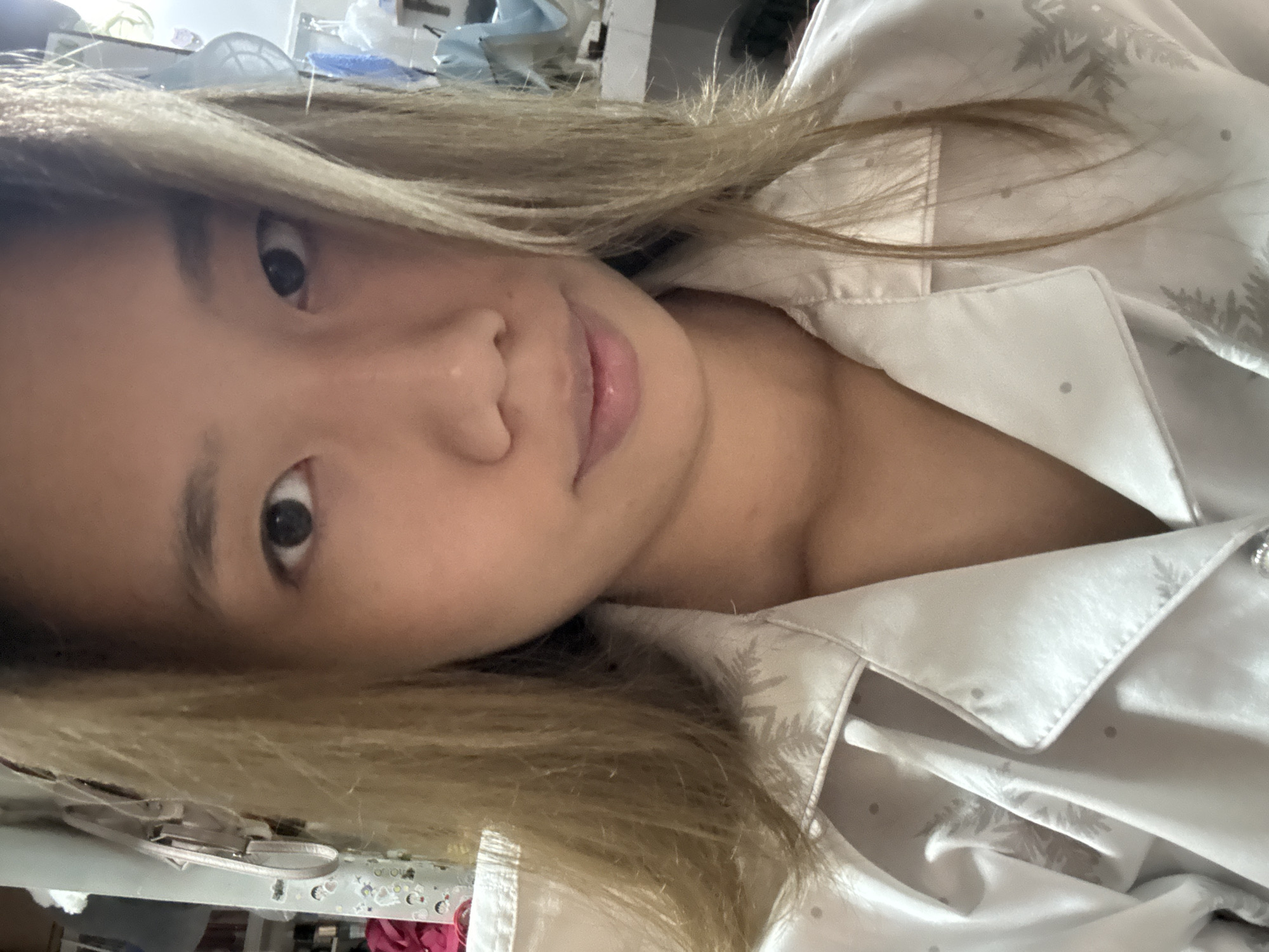 Woman takes indoor selfie in pajamas in Nan'an District
