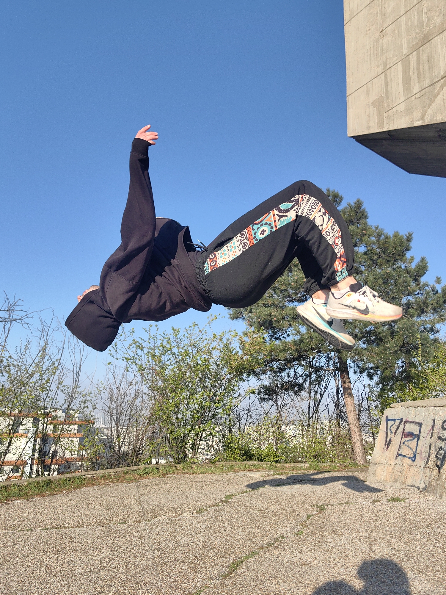 Person performs backflip in early morning Varna, Bulgaria
