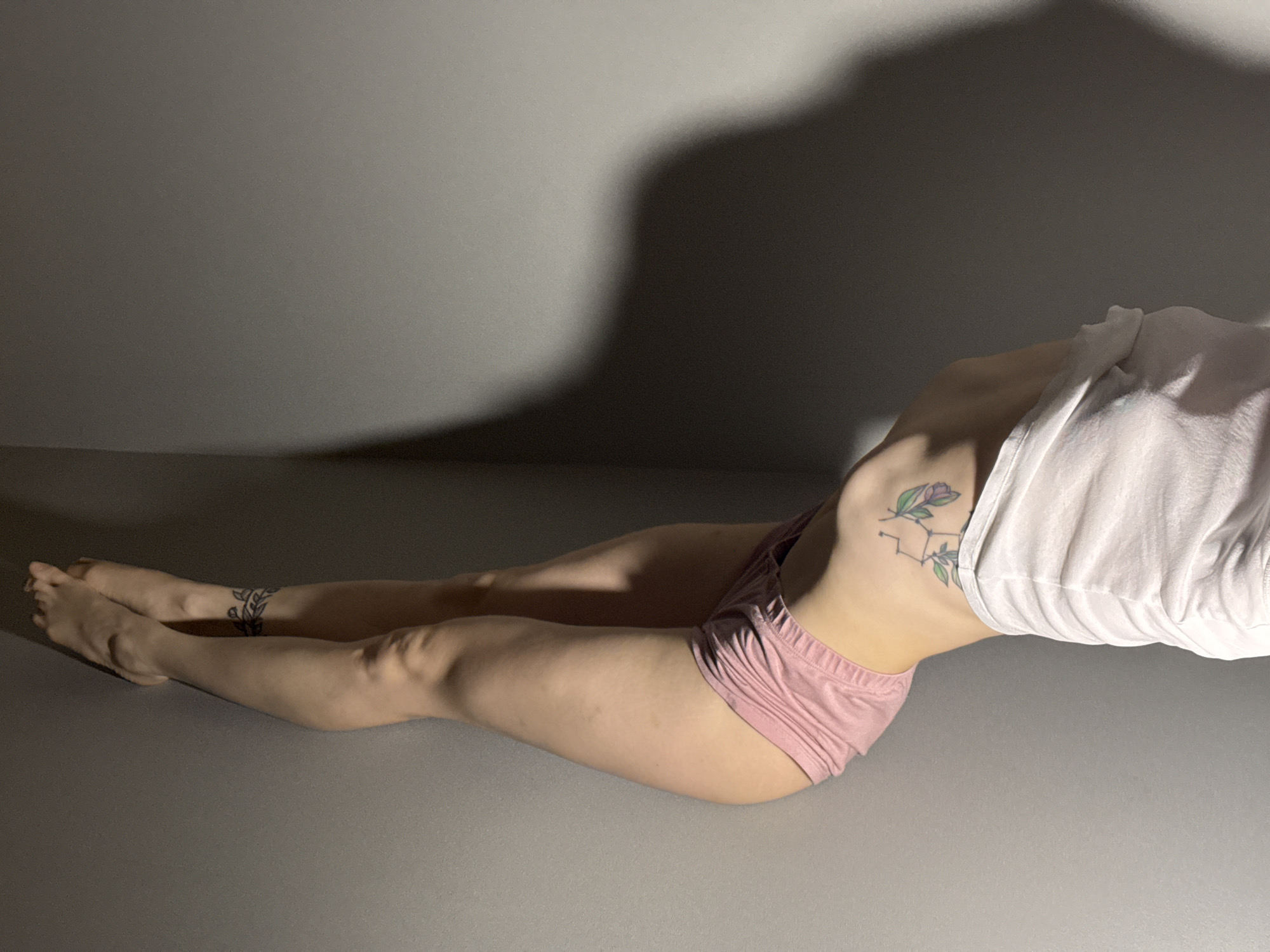 Person photographed stretching indoors in Chaikovsky, Russia