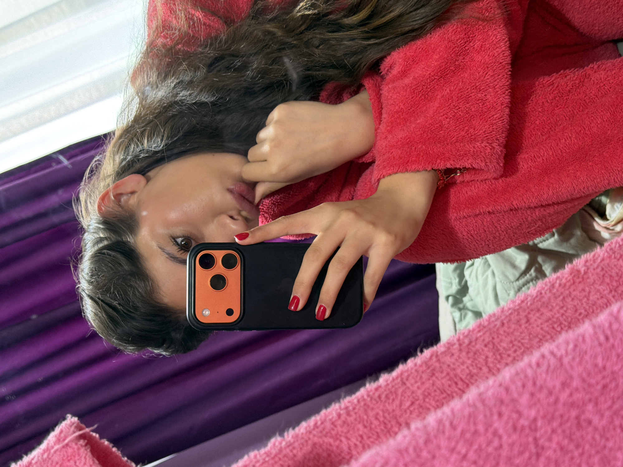 Woman takes morning selfie in fuzzy robe in Bulgaria