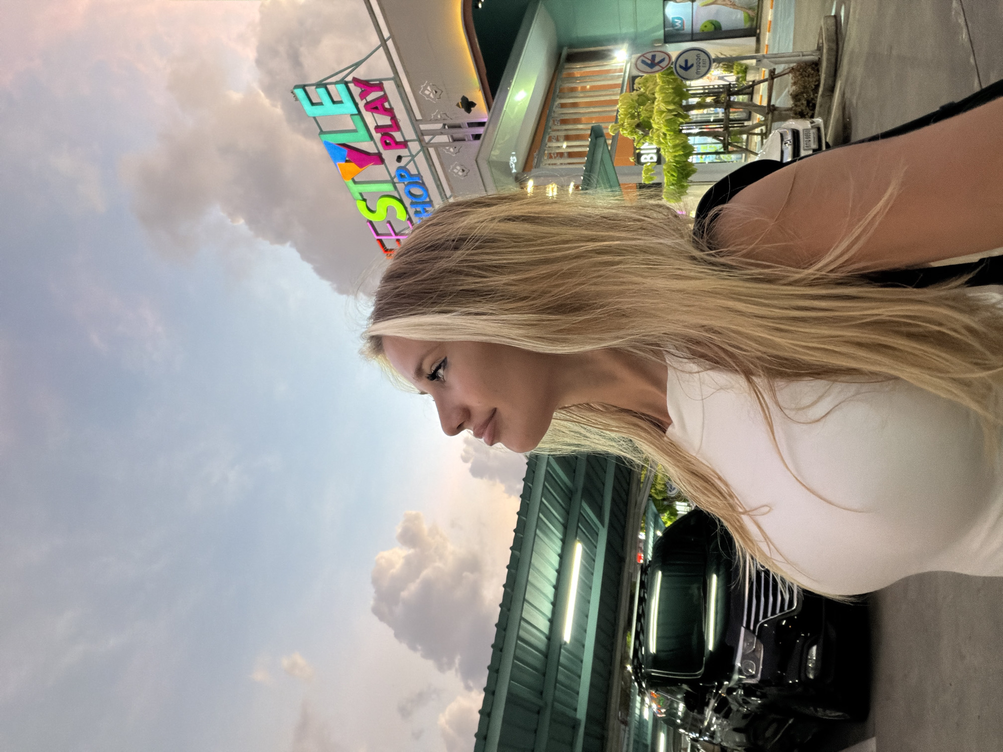 Parking lot photo session under a dramatic Si Sunthon sky