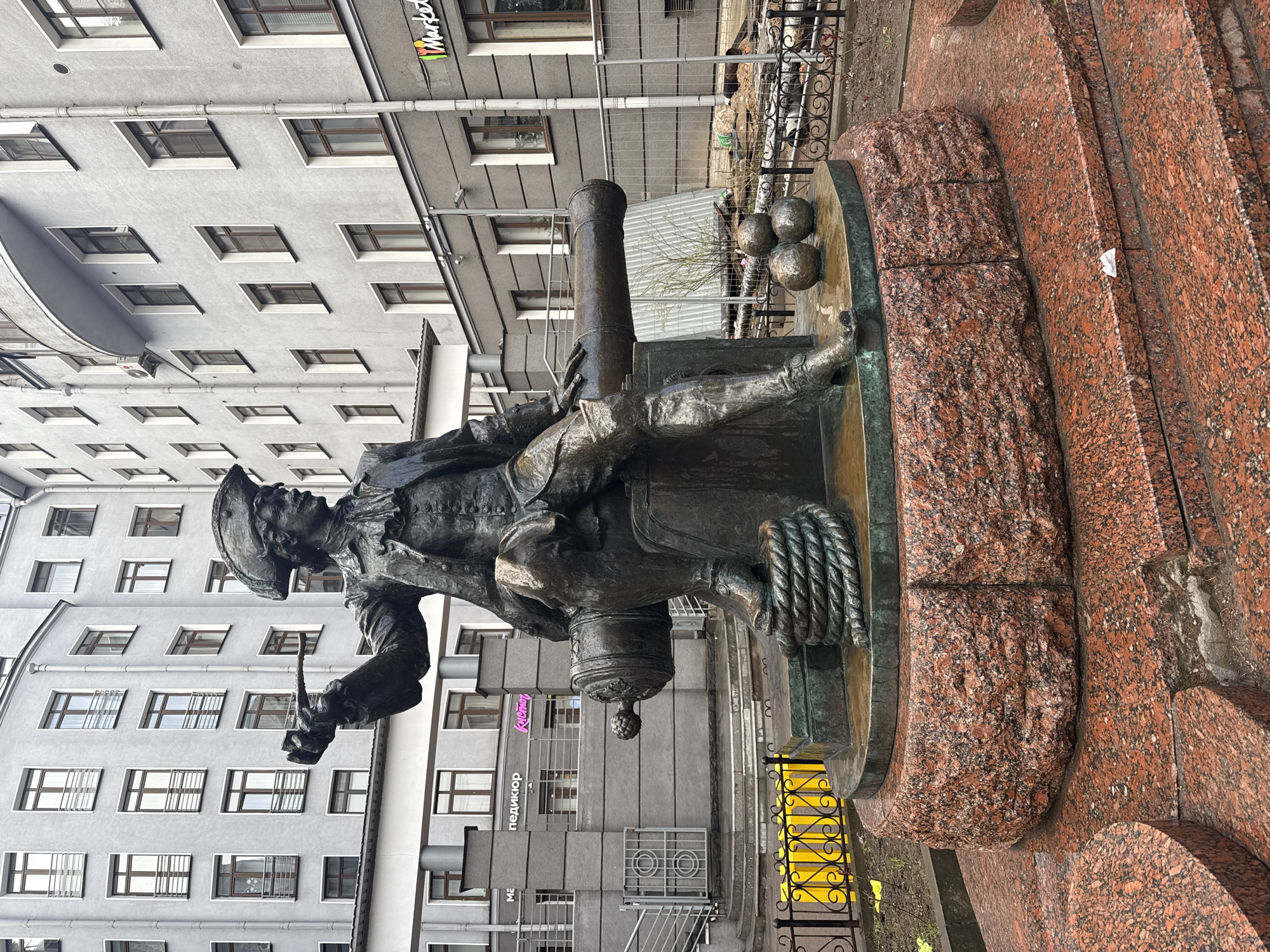 Bronze naval statue with torch observed in Saint Petersburg