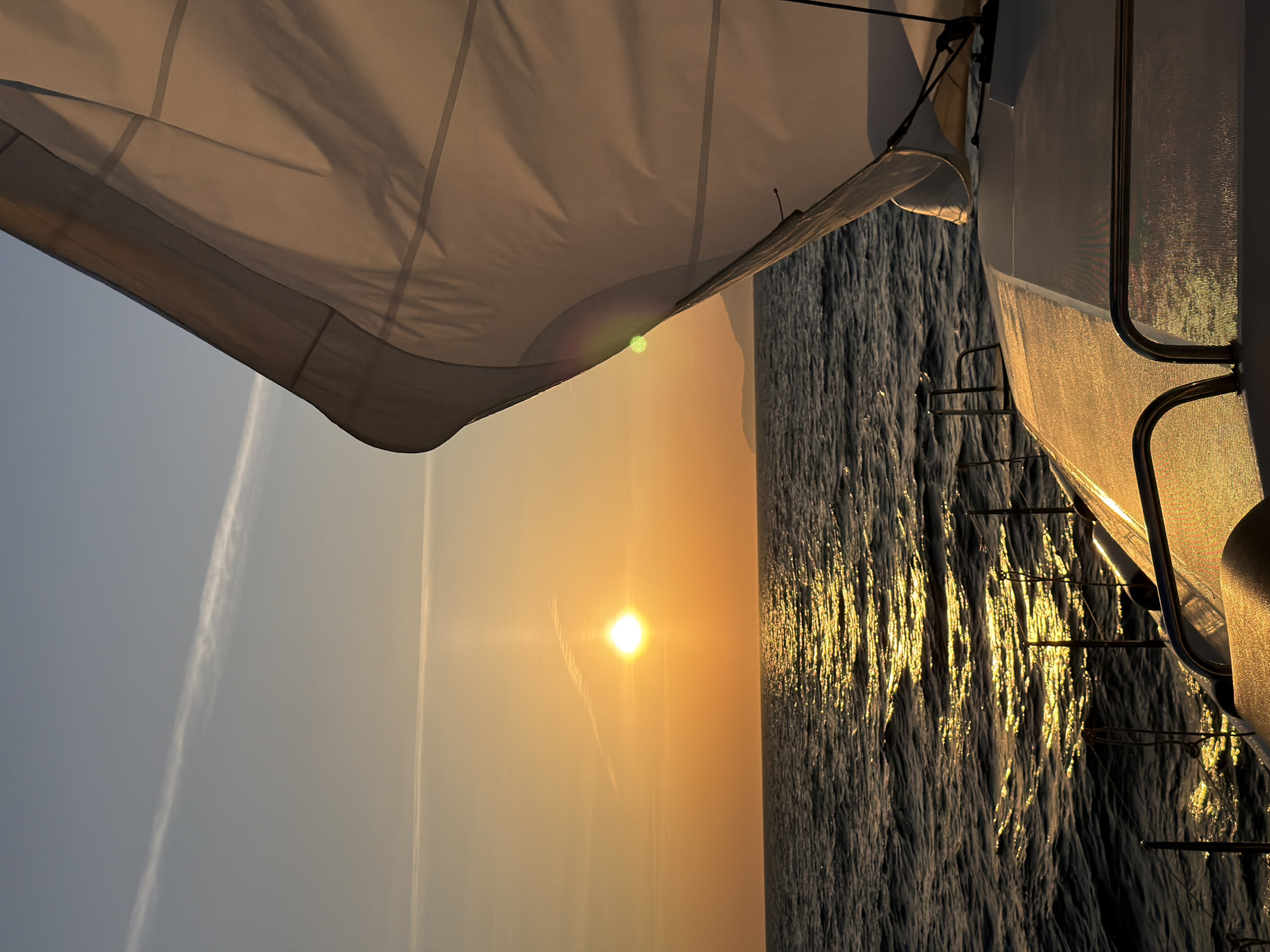 Sailing yacht witnesses golden sunset off Anacapri coast
