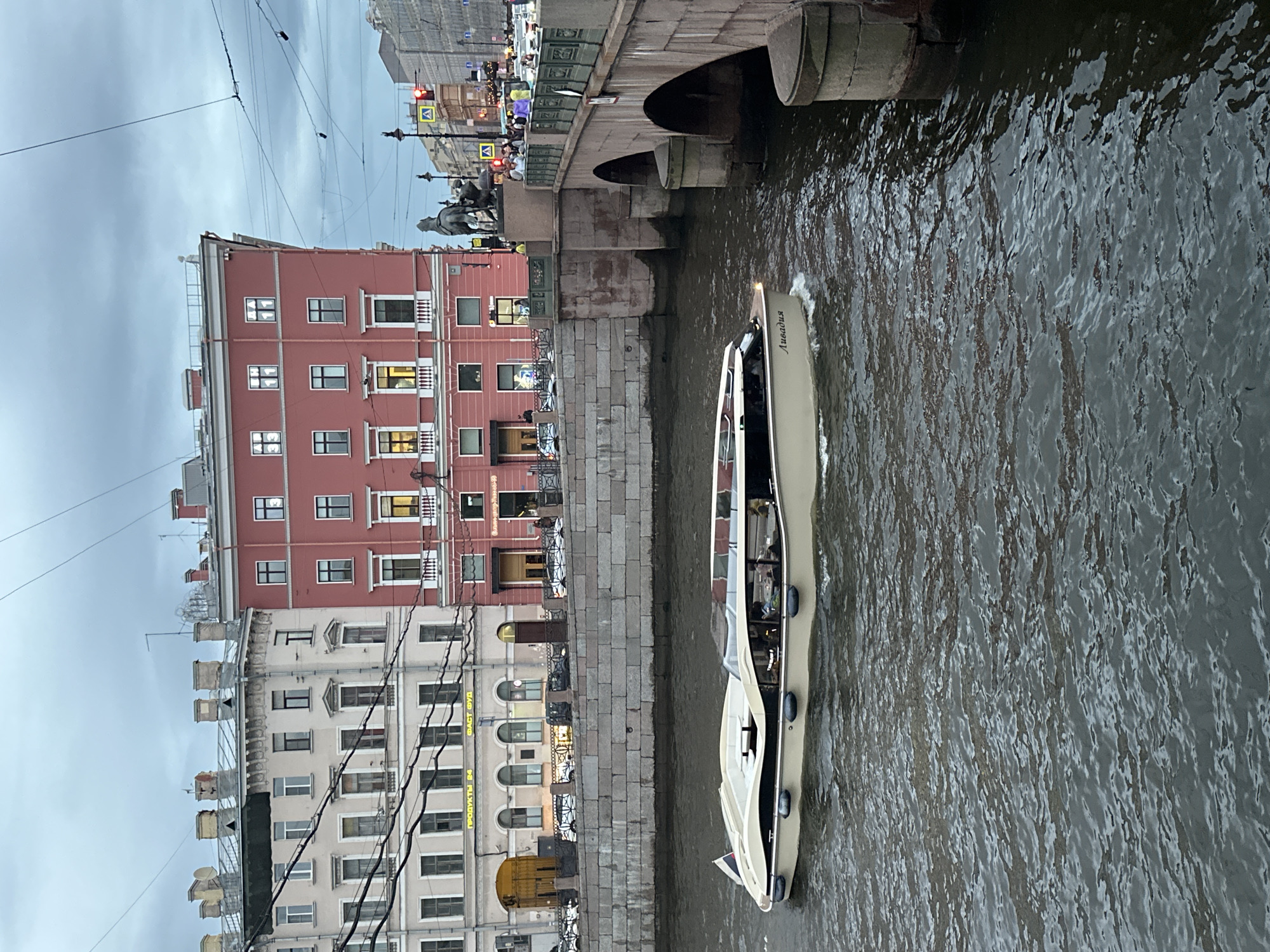 Saint Petersburg's Horse Tamers statues and canal life on a grey afternoon