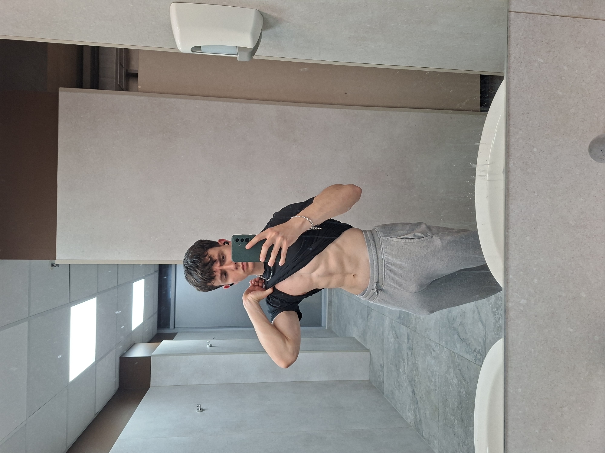 Young man takes mirror selfies in Plovdiv bathroom