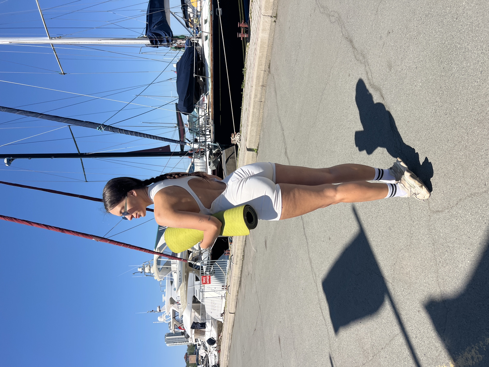 Women with yoga mat spotted at Vladivostok marina early morning