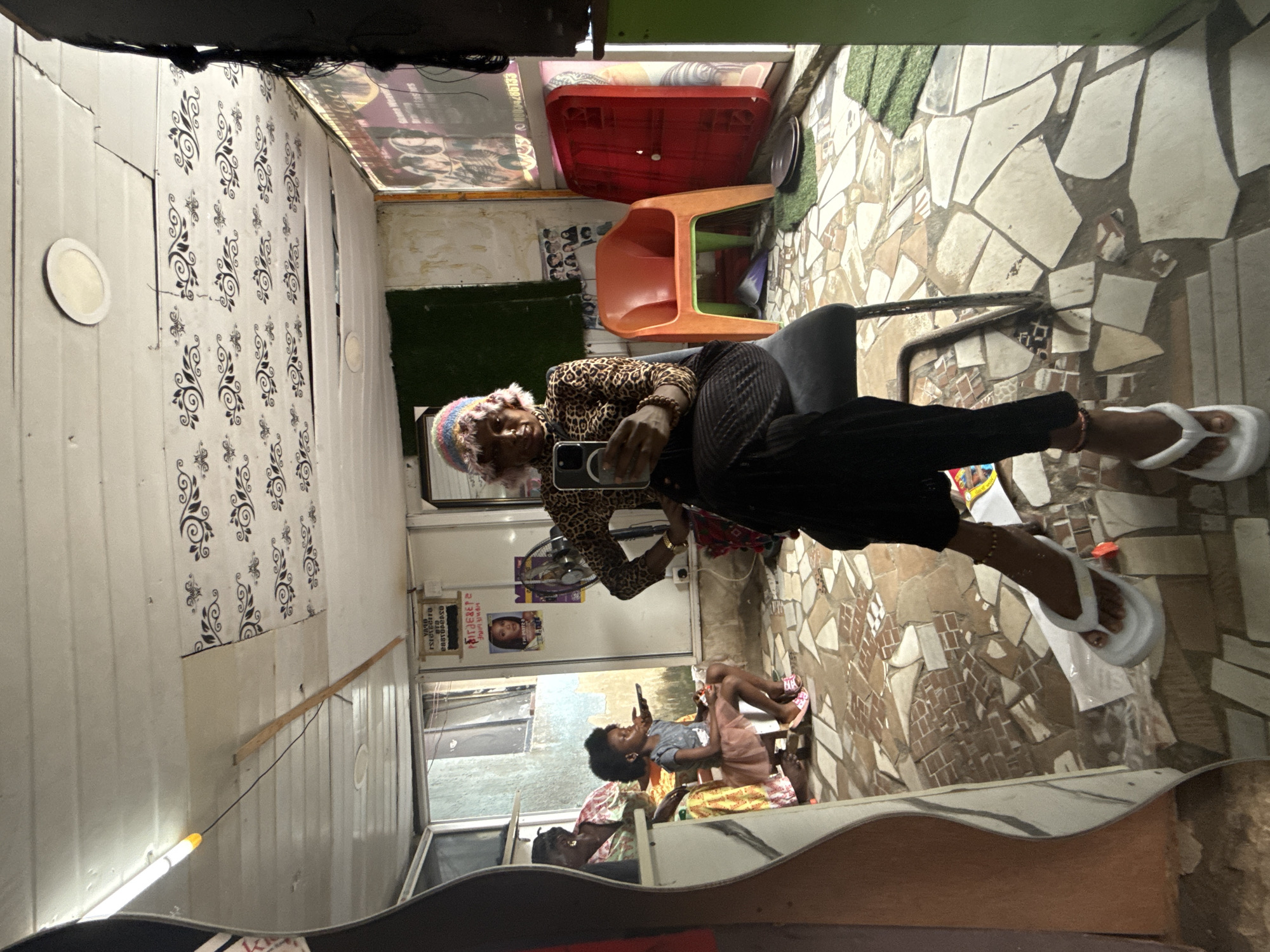 Mirror selfie moment in Ado, Nigeria, leopard print and phone in hand