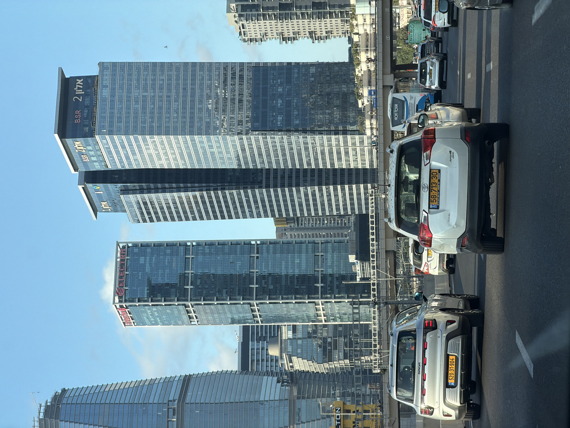 Tel Aviv streets mid-afternoon: traffic, construction, and city movement