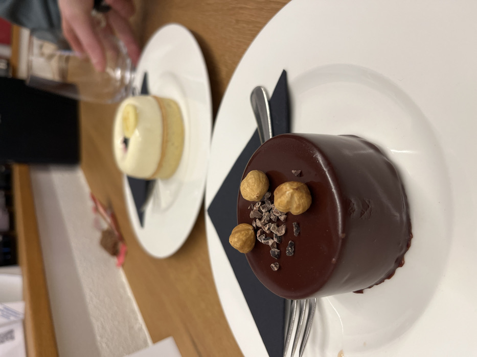 Family dessert gathering with baby and Corgi in Meisenheim