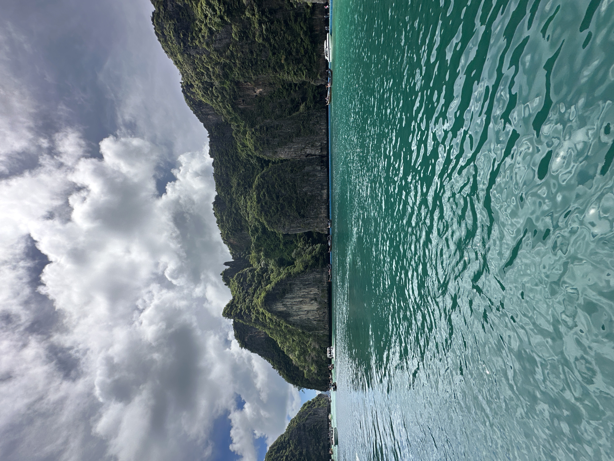 Longtail boats and limestone karsts on Ao Nang's turquoise water